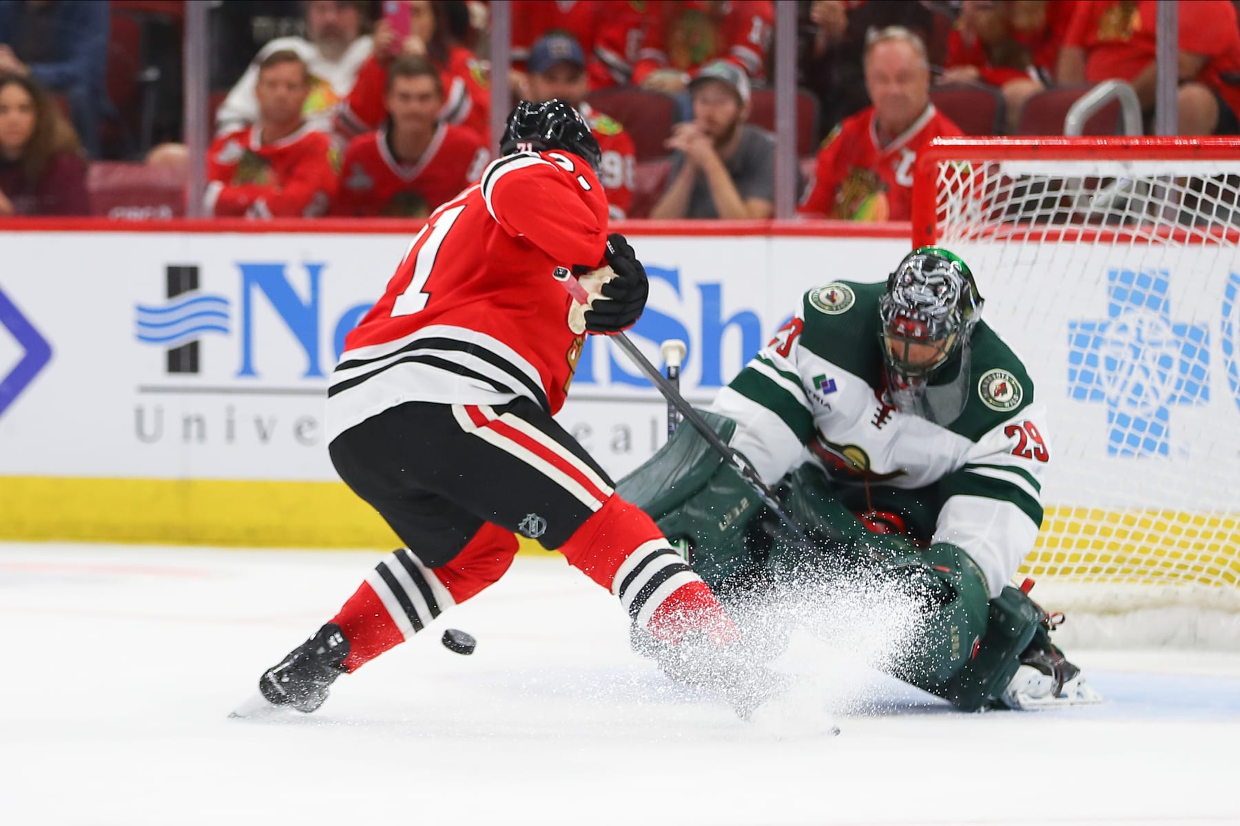 CHICAGO, IL - OCTOBER 05: Minnesota Wild goaltender Marc-Andre Fleury (29) makes a save against Chicago Blackhawks left wing Taylor Hall (71) during a shootout during a game between the Minnesota Wild and the Chicago Blackhawks on October 5, 2023 at the United Center in Chicago, IL. (Photo by Melissa Tamez/Icon Sportswire via Getty Images)