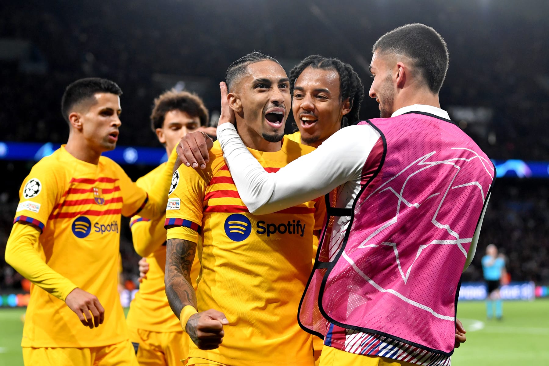PARIS, FRANCE - APRIL 10: Raphinha of FC Barcelona celebrates with teammates after scoring his team's second goal during the UEFA Champions League quarter-final first leg match between Paris Saint-Germain and FC Barcelona at Parc des Princes on April 10, 2024 in Paris, France. (Photo by Valerio Pennicino - UEFA/UEFA via Getty Images)