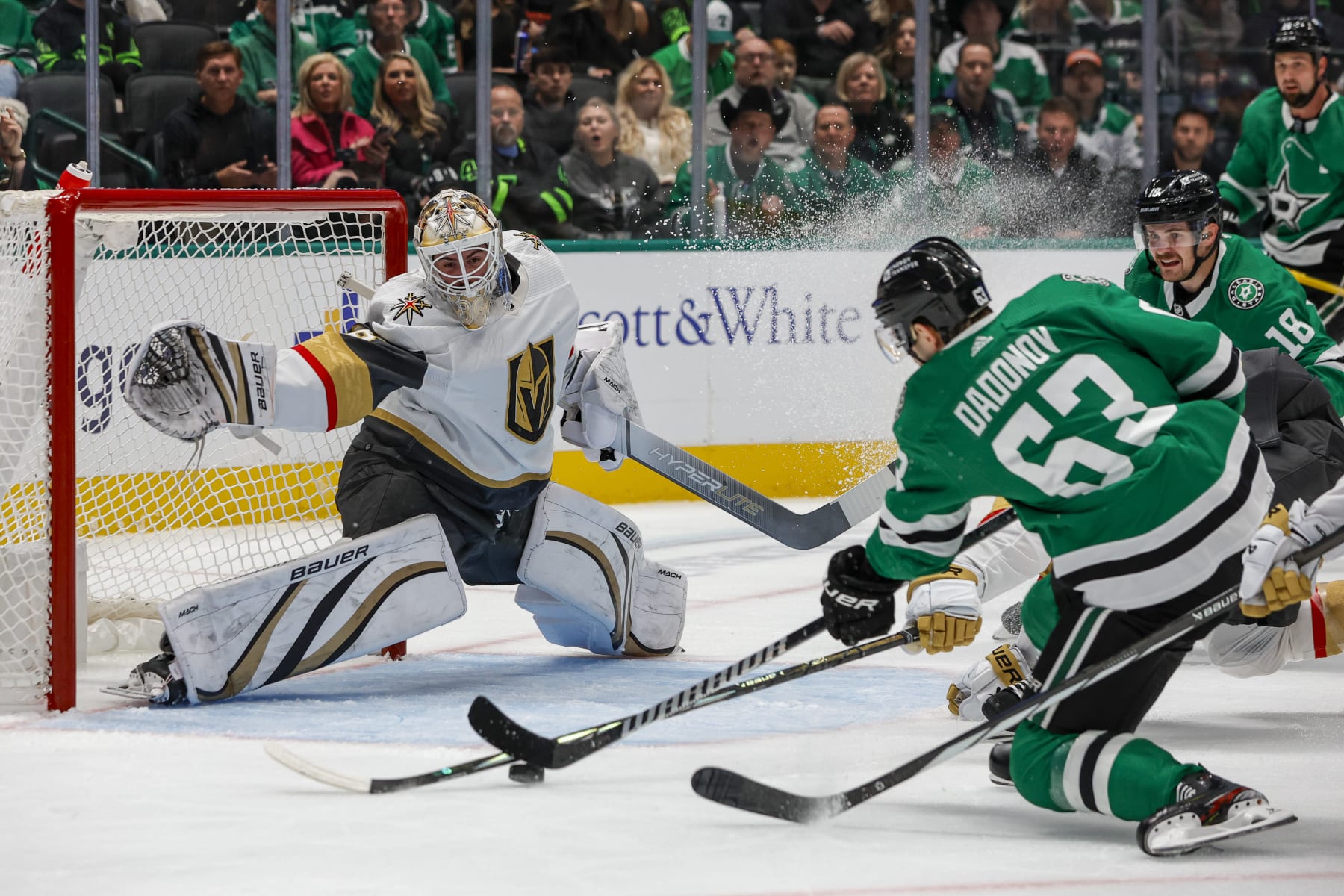 DALLAS, TX - DECEMBER 09: Dallas Stars right wing Evgenii Dadonov (63) shoots and scores a goal against Vegas Golden Knights goaltender Logan Thompson (36) during the game between the Dallas Stars and the Vegas Golden Knights on December 9, 2023 at American Airlines Center in Dallas, Texas. (Photo by Matthew Pearce/Icon Sportswire via Getty Images)