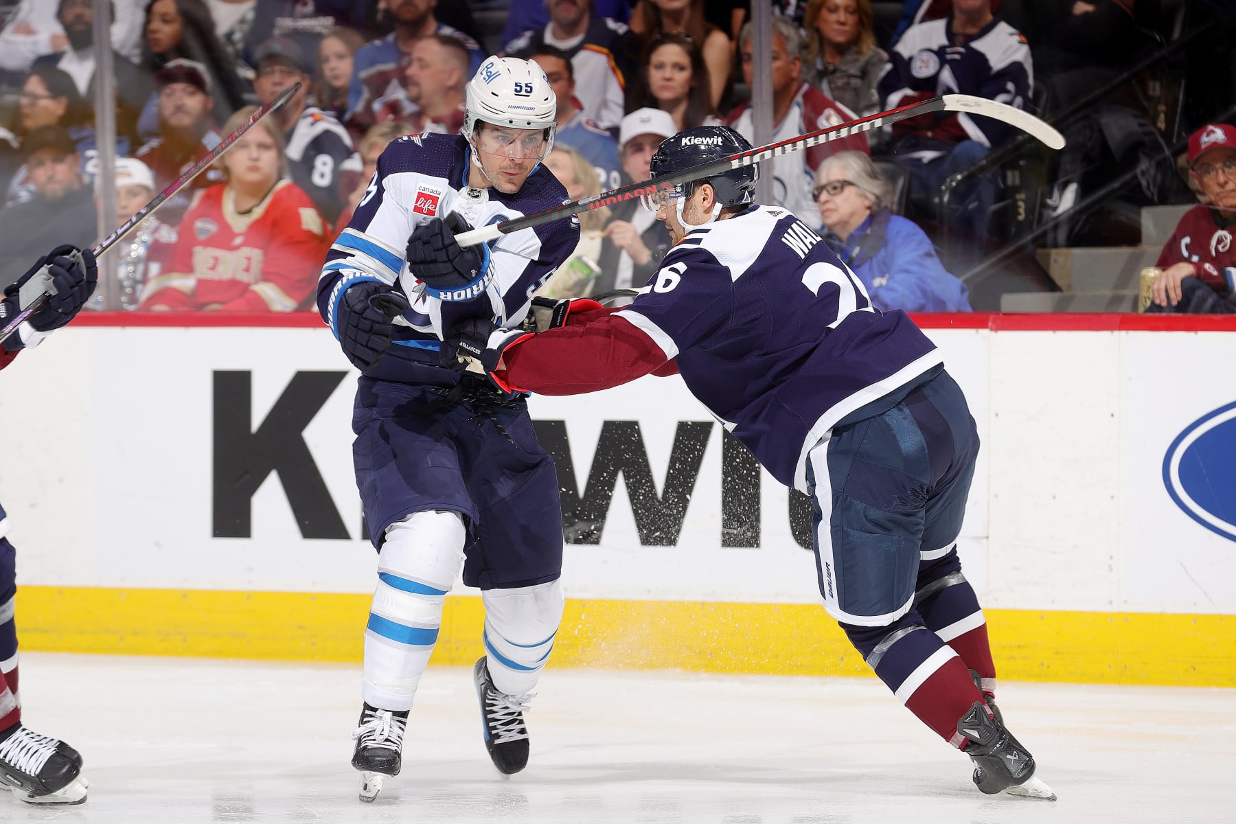 DENVER, COLORADO - APRIL 13: Mark Scheifele #55 of the Winnipeg Jets skates against Sean Walker #26 of the Colorado Avalanche at Ball Arena on April 13, 2024 in Denver, Colorado. (Photo by Michael Martin/NHLI via Getty Images)