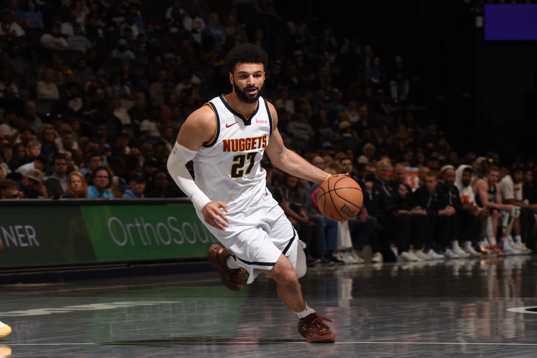 MEMPHIS, TN - APRIL 14:  Jamal Murray #27 of the Denver Nuggets handles the ball during the game against the Memphis Grizzlies on April 14, 2024 at FedExForum in Memphis, Tennessee. NOTE TO USER: User expressly acknowledges and agrees that, by downloading and or using this photograph, User is consenting to the terms and conditions of the Getty Images License Agreement. Mandatory Copyright Notice: Copyright 2024 NBAE (Photo by Grant Burke/NBAE via Getty Images)