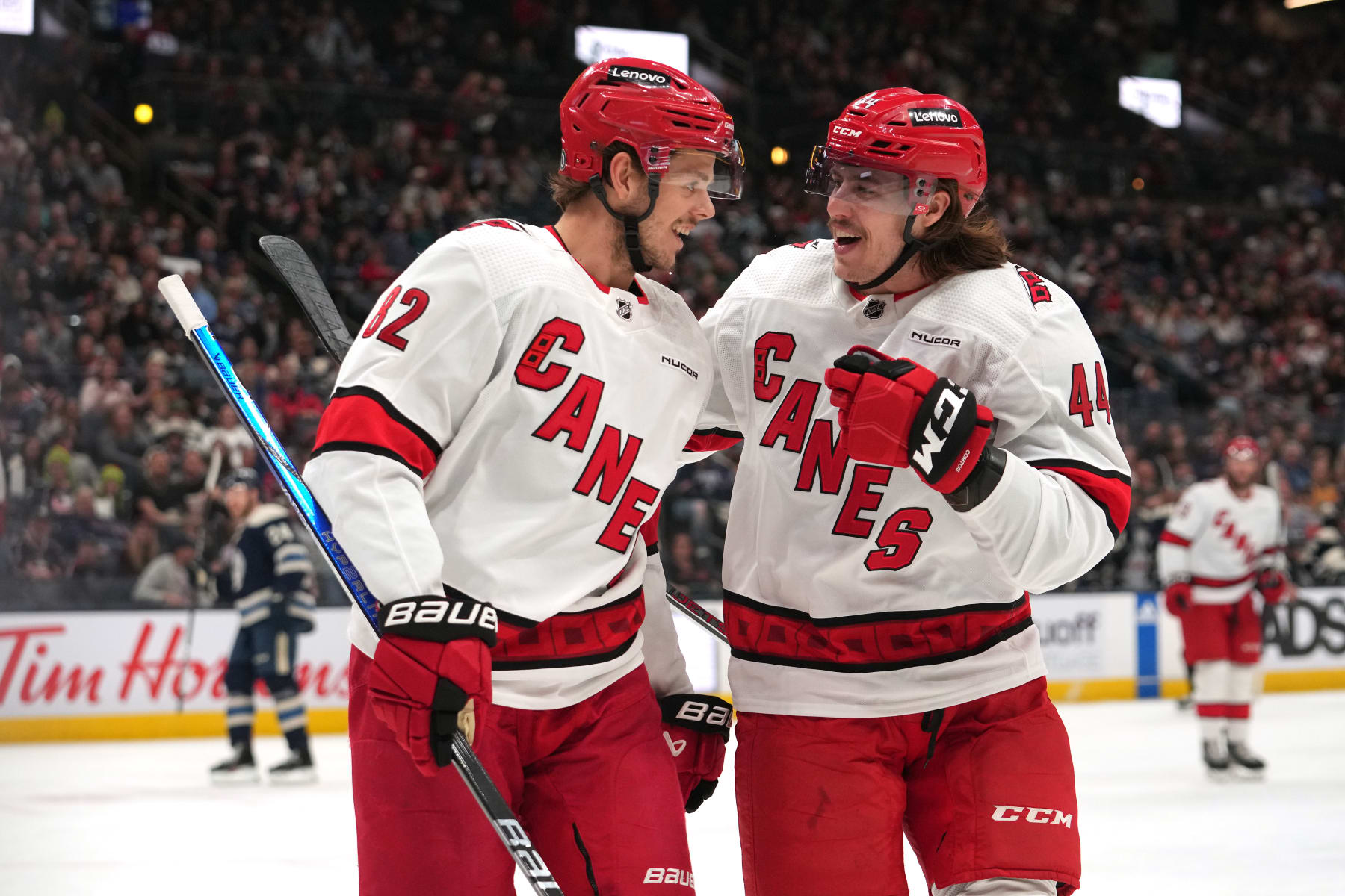 COLUMBUS, OHIO - APRIL 16: Jesperi Kotkaniemi #82 and Maxime Comtois #44 of the Carolina Hurricanes celebrate a goal in the first period against the Columbus Blue Jackets at Nationwide Arena on April 16, 2024 in Columbus, Ohio. (Photo by Jason Mowry/Getty Images)