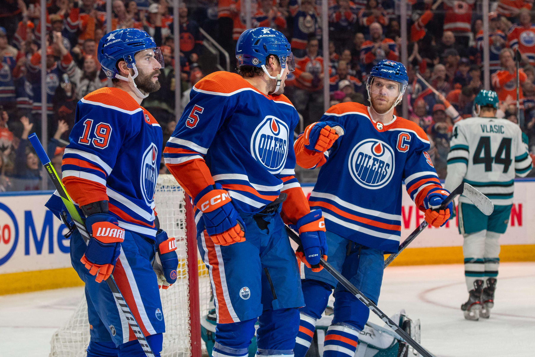 EDMONTON, CANADA - APRIL 15: Cody Ceci #5 of the Edmonton Oilers celebrates his second-period goal against the San Jose Sharks with teammates Connor McDavid #97 and Adam Henrique #19 at Rogers Place on April 15, 2024, in Edmonton, Alberta, Canada. (Photo by Andy Devlin/NHLI via Getty Images)