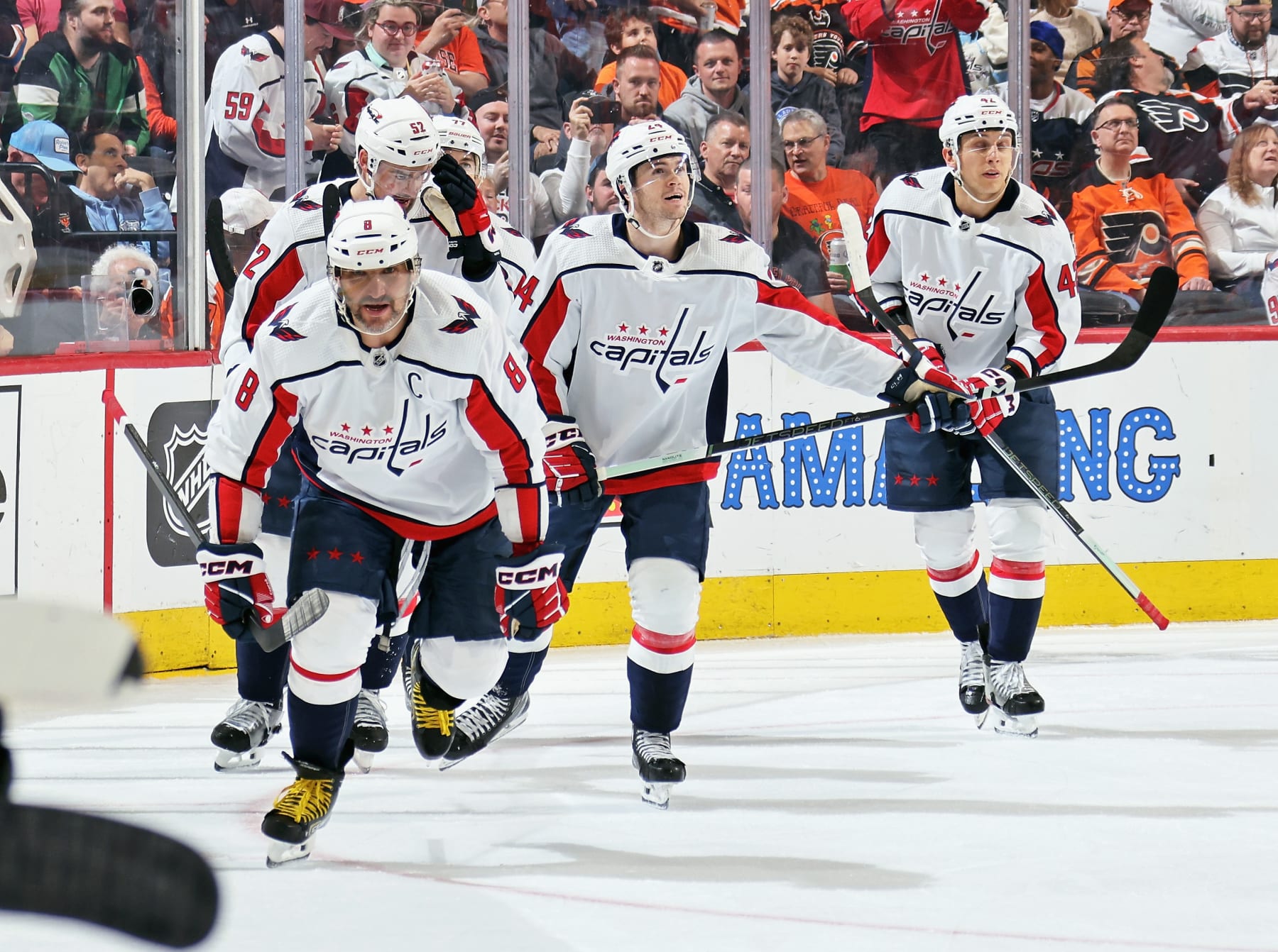 PHILADELPHIA, PENNSYLVANIA - APRIL 16: Alex Ovechkin #8 of the Washington Capitals celebrates his first period goal against the Philadelphia Flyers with Dylan McIlrath #52, T.J. Oshie #77, Connor McMichael #24, and Martin Fehervary #42 at the Wells Fargo Center on April 16, 2024 in Philadelphia, Pennsylvania. (Photo by Len Redkoles/NHLI via Getty Images)