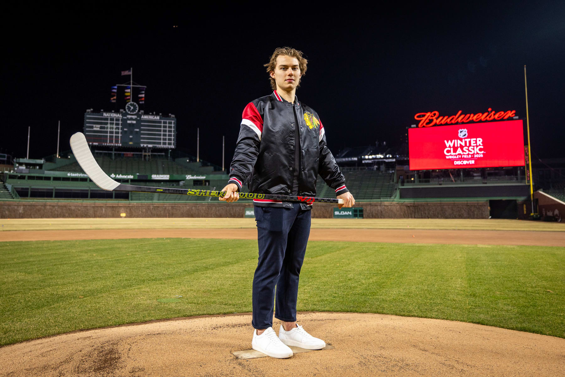 CHICAGO, ILLINOIS - FEBRUARY 07: Connor Bedard #98 of the Chicago Blackhawks poses for a portrait after announcing that the 2025 Discover NHL Winter Classic will feature the Chicago Blackhawks hosting the St. Louis Blues at Wrigley Field on February 07, 2024 in Chicago, Illinois. (Photo by Chase Agnello-Dean/NHLI via Getty Images)