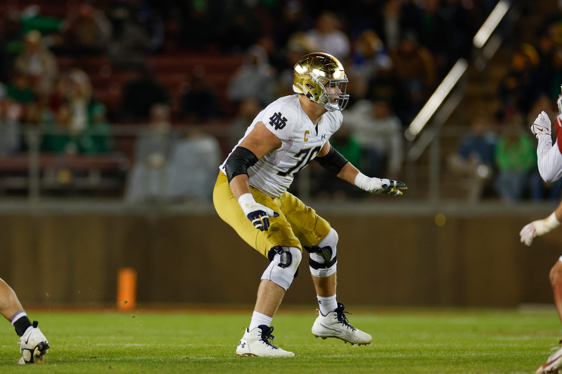 STANFORD, CALIFORNIA - NOVEMBER 25: Joe Alt #76 of the Notre Dame Fighting Irish blocks in the second half during a game against the Stanford Cardinal at Stanford Stadium on November 25, 2023 in Stanford, California. (Photo by Brandon Sloter/Image Of Sport/Getty Images)