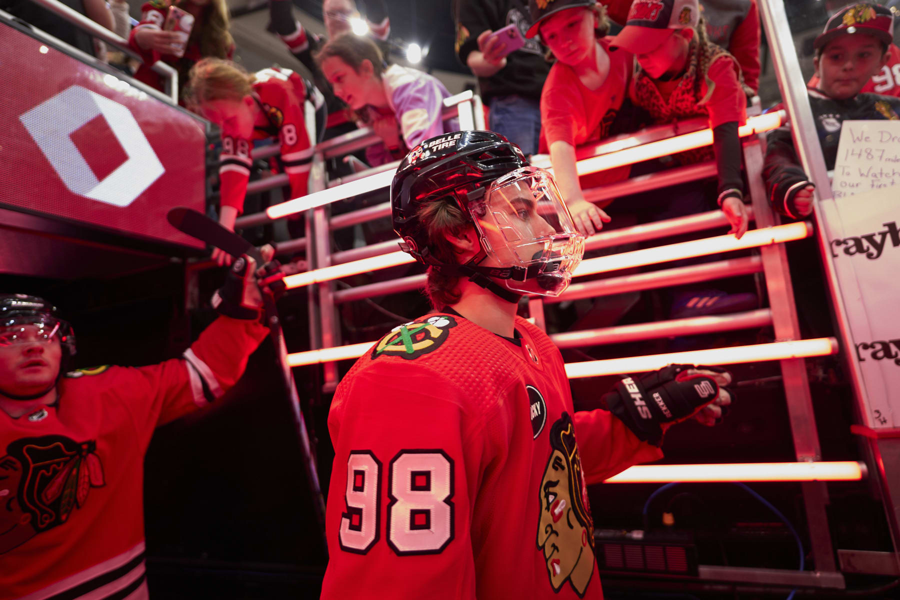 CHICAGO, ILLINOIS - APRIL 14: Connor Bedard #98 of the Chicago Blackhawks walks out to the ice prior to the game against the Carolina Hurricanes at the United Center on April 14, 2024 in Chicago, Illinois. (Photo by Bill Smith/NHLI via Getty Images)