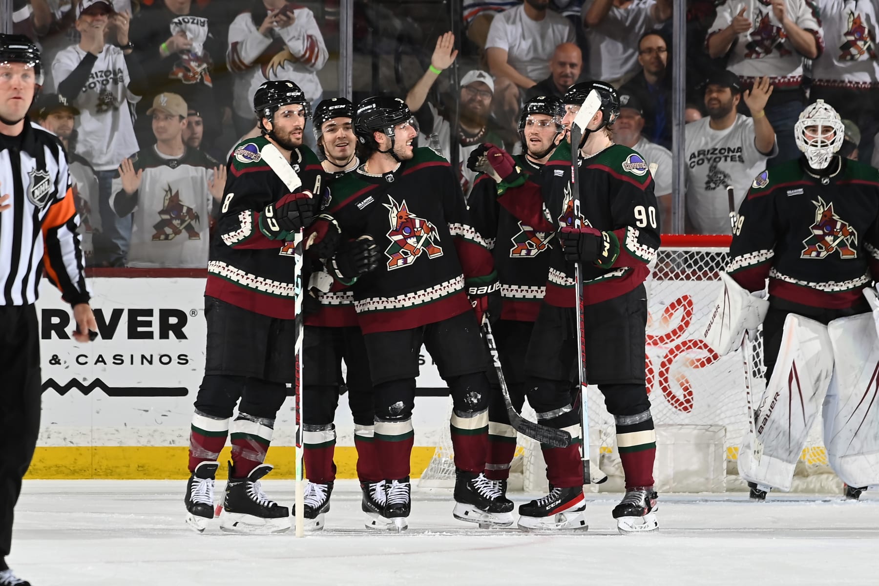 TEMPE, ARIZONA - APRIL 17: Sean Durzi #50 of the Arizona Coyotes celebrates with Nick Schmaltz #8, JJ Moser #90 and teammates after scoring a goal against the Edmonton Oilers during the third period of the game at Mullett Arena on April 17, 2024 in Tempe, Arizona. (Photo by Norm Hall/NHLI via Getty Images)