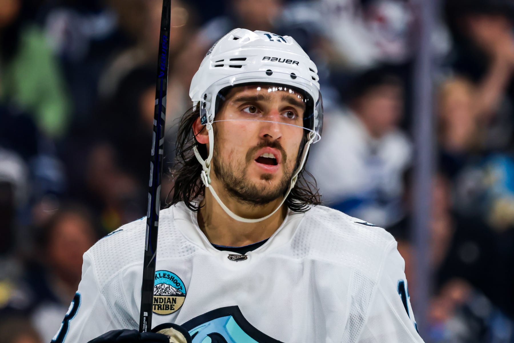 WINNIPEG, CANADA - APRIL 16: Brandon Tanev #13 of the Seattle Kraken looks on during a second period stoppage in play against the Winnipeg Jets at the Canada Life Centre on April 16, 2024 in Winnipeg, Manitoba, Canada. (Photo by Jonathan Kozub/NHLI via Getty Images)