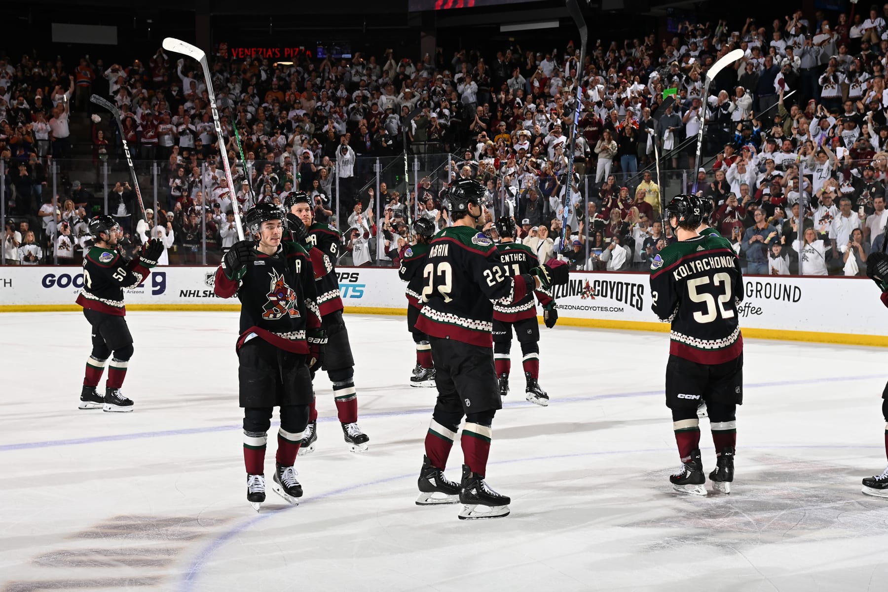 TEMPE, ARIZONA - APRIL 17: Clayton Keller #9, Jack McBain #22 of the Arizona Coyotes and teammates salute the fans after a 5-2 win against the Edmonton Oilers at Mullett Arena on April 17, 2024 in Tempe, Arizona. (Photo by Norm Hall/NHLI via Getty Images)