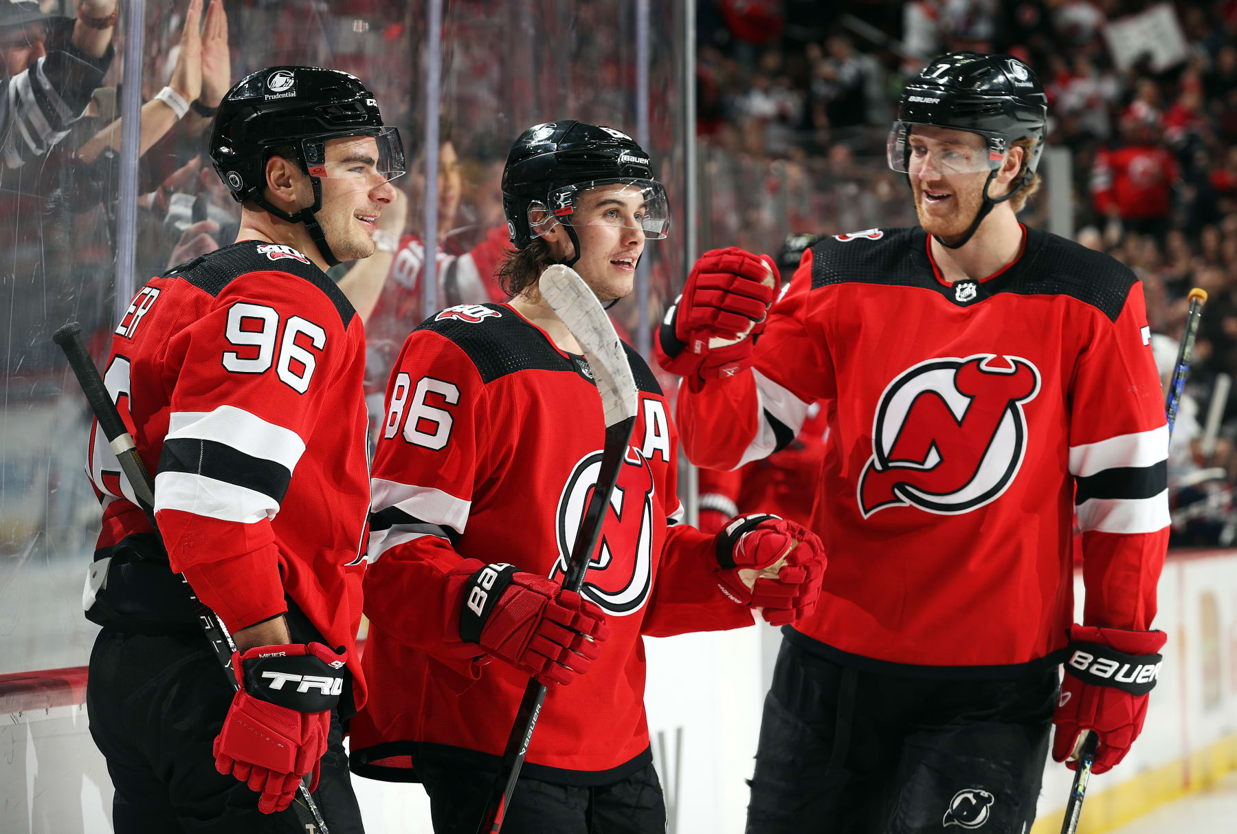 NEWARK, NEW JERSEY - APRIL 06: Jack Hughes #86 of the New Jersey Devils is congratulated by teammates Timo Meier #96 and Dougie Hamilton #7 after scoring during the 2nd period of the game against the Columbus Blue Jackets at Prudential Center on April 06, 2023 in Newark, New Jersey. (Photo by Jamie Squire/Getty Images)