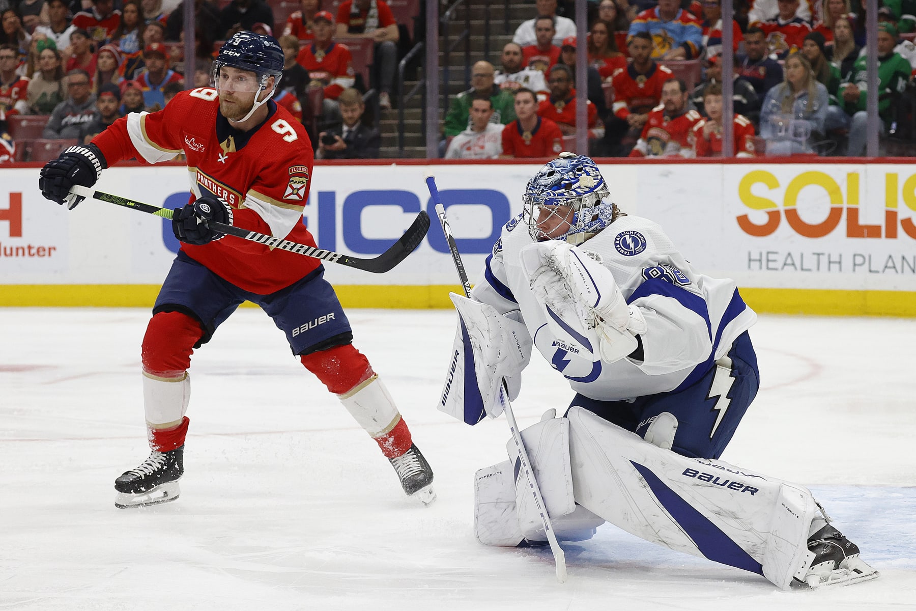 SUNRISE, FLORIDA - MARCH 16: Goaltender Andrei Vasilevskiy #88 of the Tampa Bay Lightning defends the net against Sam Bennett #9 of the Florida Panthers at the Amerant Bank Arena on March 16, 2024 in Sunrise, Florida. (Photo by Eliot J. Schechter/NHLI via Getty Images)