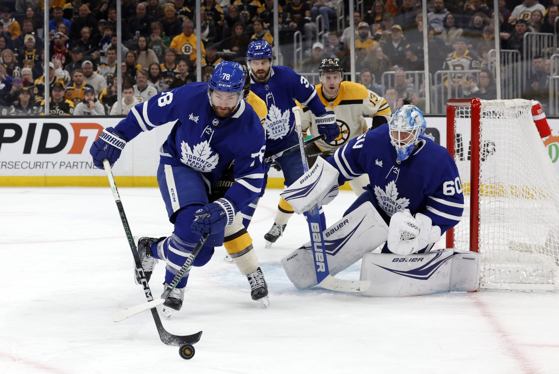 BOSTON, MA - MARCH 07: Toronto Maple Leafs defenseman T.J. Brodie (78) picks up the puck during a game between the Boston Bruins and the Toronto Maple Leafs on March 7, 2024, at TD Garden in Boston, Massachusetts. (Photo by Fred Kfoury III/Icon Sportswire via Getty Images)