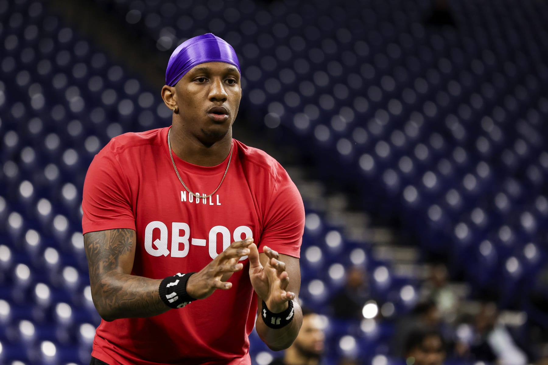 INDIANAPOLIS, INDIANA - MARCH 2: Michael Penix #QB08 of Washington prepares for a snap during the NFL Scouting Combine at Lucas Oil Stadium on March 2, 2024 in Indianapolis, Indiana. (Photo by Kara Durrette/Getty Images)