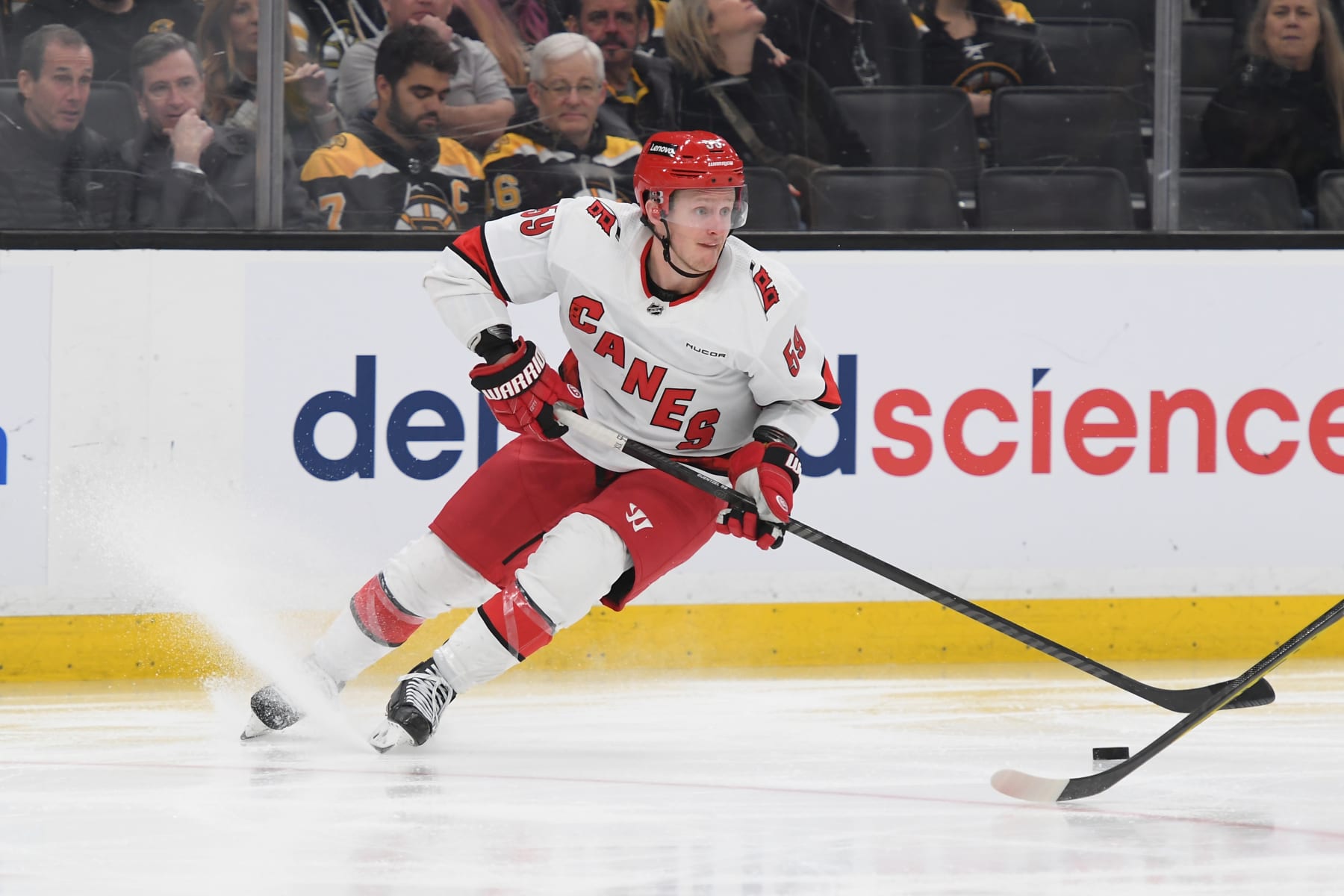 BOSTON, MASSACHUSETTS - APRIL 9: Jake Guentzel #59 of the Carolina Hurricanes skates with the puck against the Boston Bruins at the TD Garden on April 9, 2024 in Boston, Massachusetts. (Photo by Steve Babineau/NHLI via Getty Images)