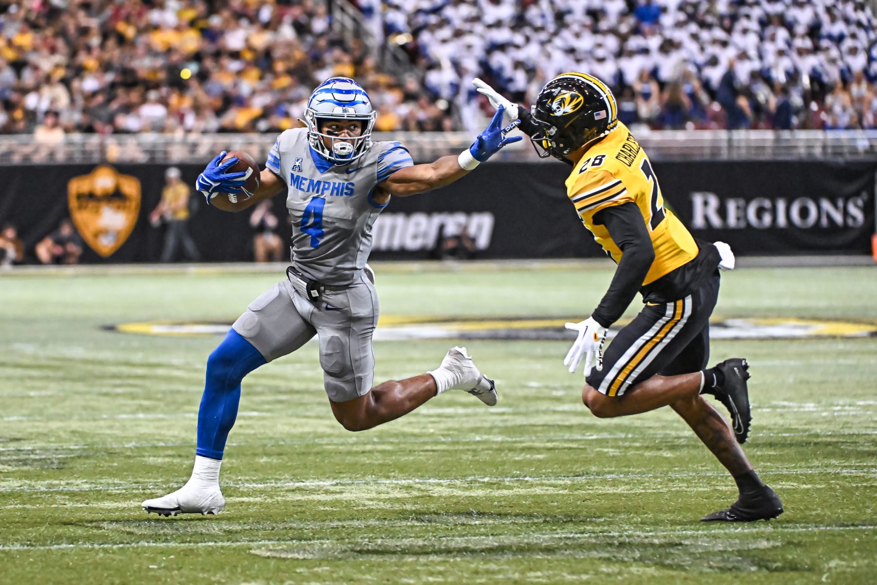 ST. LOUIS, MO - SEPTEMBER 23: Memphis Tigers running back Blake Watson (4) tries to use a stiff arm to get around Missouri Tigers defensive back Joseph Charleston (28) during a non conference game between the Memphis Tigers and the Missouri Tigers held on Saturday Sep 23, 2023 at The Dome in St. Louis, MO. (Photo by Rick Ulreich/Icon Sportswire via Getty Images
