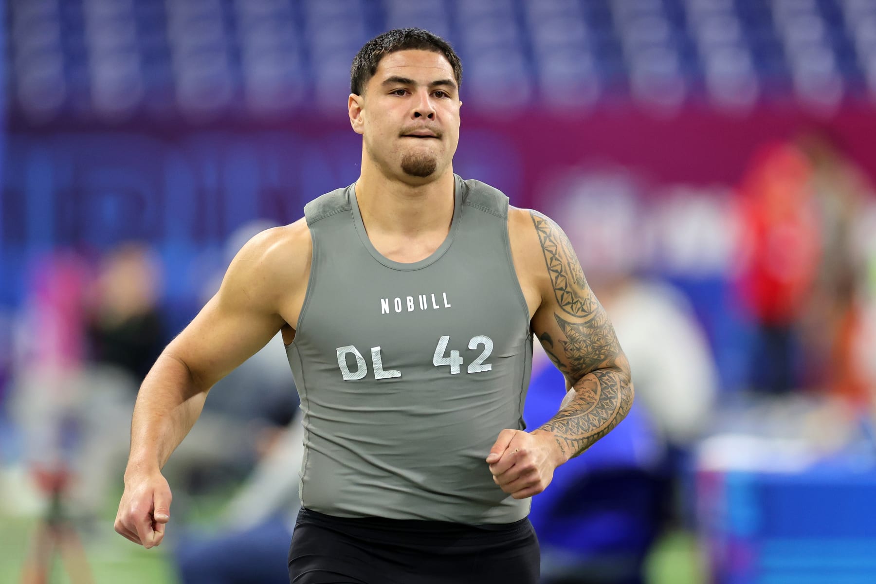 INDIANAPOLIS, INDIANA - FEBRUARY 29: Laiatu Latu #DL42 of UCLA participates in the 40-yard dash during the NFL Combine at Lucas Oil Stadium on February 29, 2024 in Indianapolis, Indiana. (Photo by Stacy Revere/Getty Images)