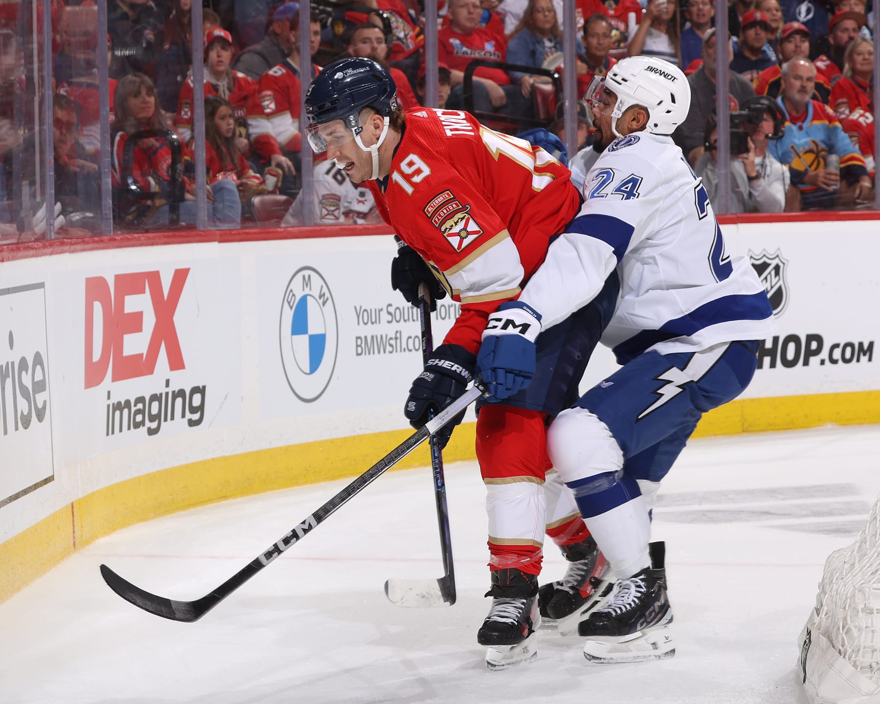 SUNRISE, FL - APRIL 21: Matt Dumba #24 of the Tampa Bay Lightning checks Matthew Tkachuk #19 of the Florida Panthers in Game One of the First Round of the 2024 Stanley Cup Playoffs at the Amerant Bank Arena on April 21, 2024 in Sunrise, Florida. (Photo by Joel Auerbach/Getty Images)