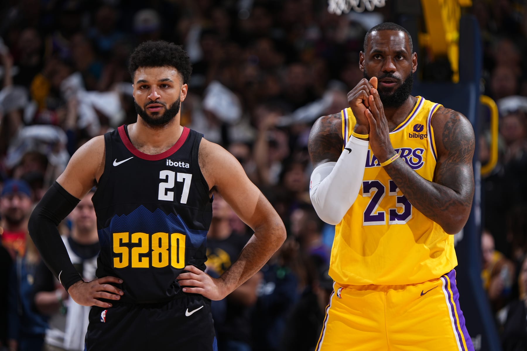 DENVER, CO - APRRIL 22: Jamal Murray #27 of the Denver Nuggets and LeBron James #23 of the Los Angeles Lakers look on during the game during Round 1 Game 2 of the 2024 NBA Playoffs on April 22, 2024 at the Ball Arena in Denver, Colorado. NOTE TO USER: User expressly acknowledges and agrees that, by downloading and/or using this Photograph, user is consenting to the terms and conditions of the Getty Images License Agreement. Mandatory Copyright Notice: Copyright 2024 NBAE (Photo by Garrett Ellwood/NBAE via Getty Images)