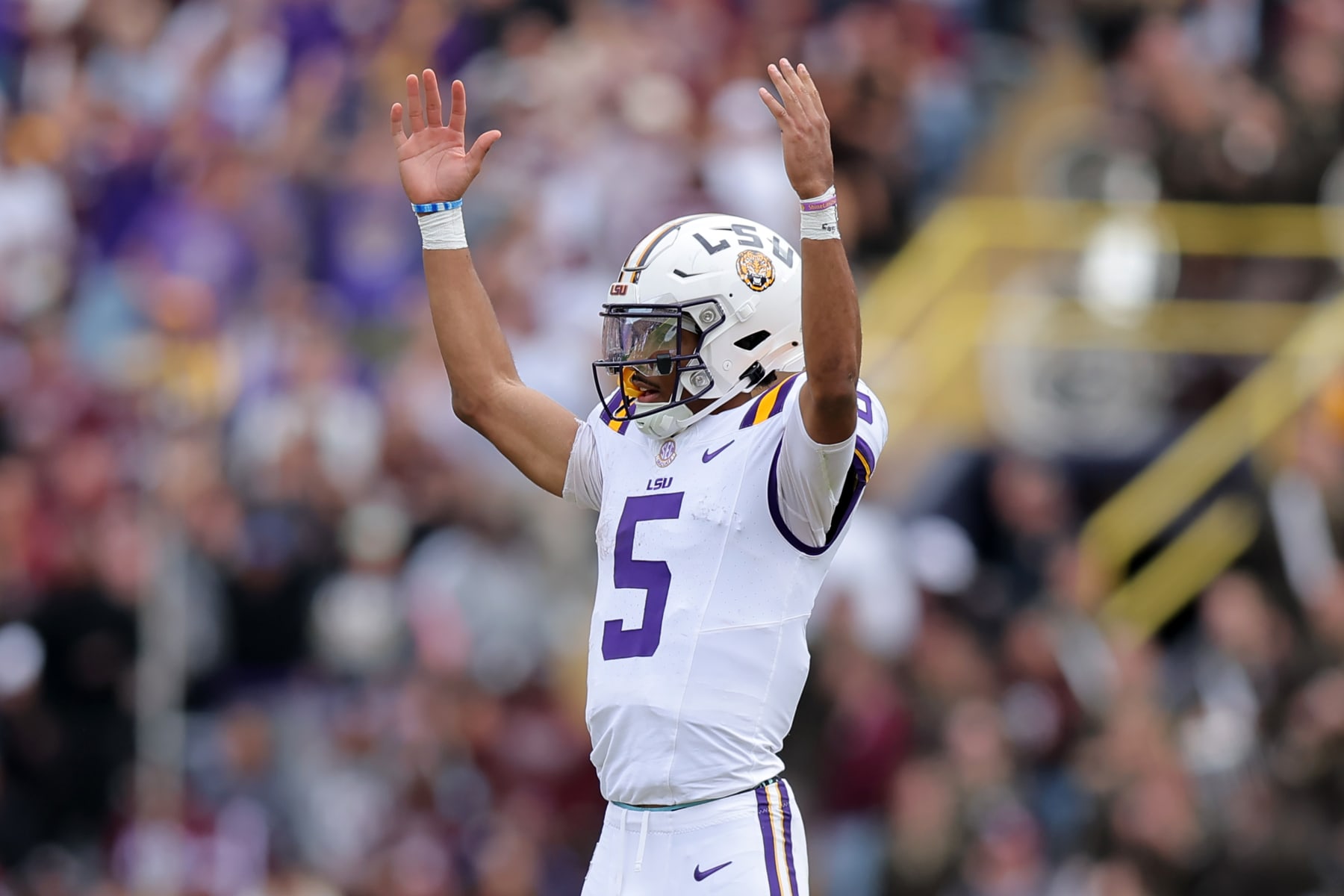BATON ROUGE, LOUISIANA - NOVEMBER 25: Jayden Daniels #5 of the LSU Tigers celebrates a touchdown during a game against the Texas A&M Aggies at Tiger Stadium on November 25, 2023 in Baton Rouge, Louisiana. (Photo by Jonathan Bachman/Getty Images)