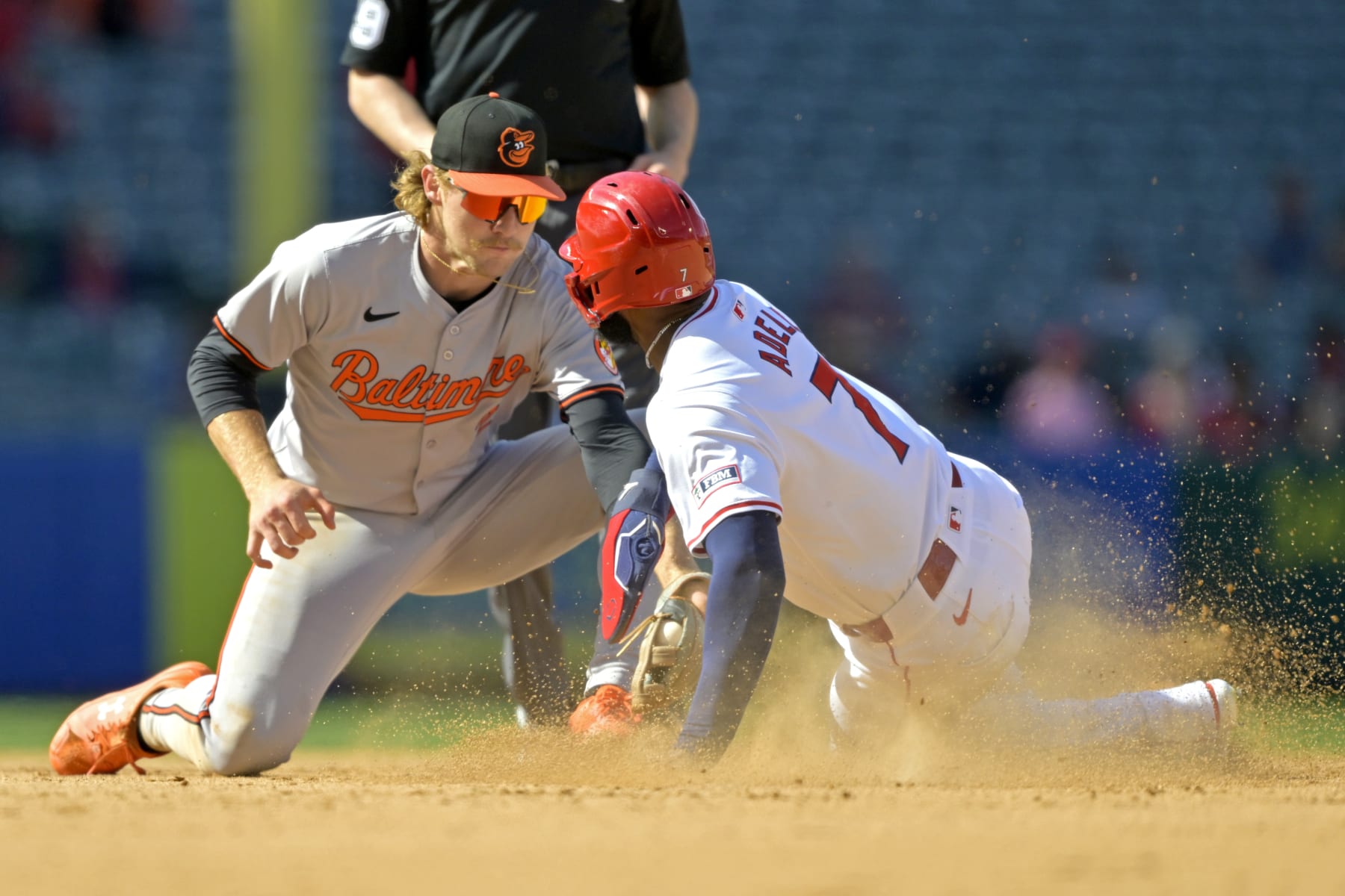 ANAHEIM, CALIFORNIA - APRIL 24: After a review of the play Jo Adell #7 of the Los Angeles Angels is caught stealing on a tag by Gunnar Henderson #2 of the Baltimore Orioles in the ninth inning at Angel Stadium of Anaheim on April 24, 2024 in Anaheim, California. (Photo by Jayne Kamin-Oncea/Getty Images)