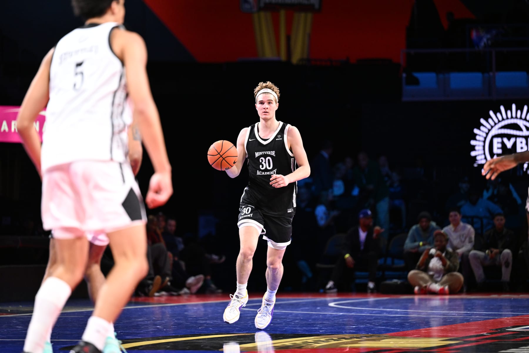 LAS VEGAS, NV - DECEMBER 8: Liam McNeeley #30 of the Montverde Academy dribbles the ball during the game against the Link Academy during the 2023 EYBL Scholastic Showcase on December 8, 2023 at T-Mobile Arena in Las Vegas, Nevada. NOTE TO USER: User expressly acknowledges and agrees that, by downloading and or using this photograph, User is consenting to the terms and conditions of the Getty Images License Agreement. Mandatory Copyright Notice: Copyright 2023 NBAE (Photo by Tom O'Connor/NBAE via Getty Images)