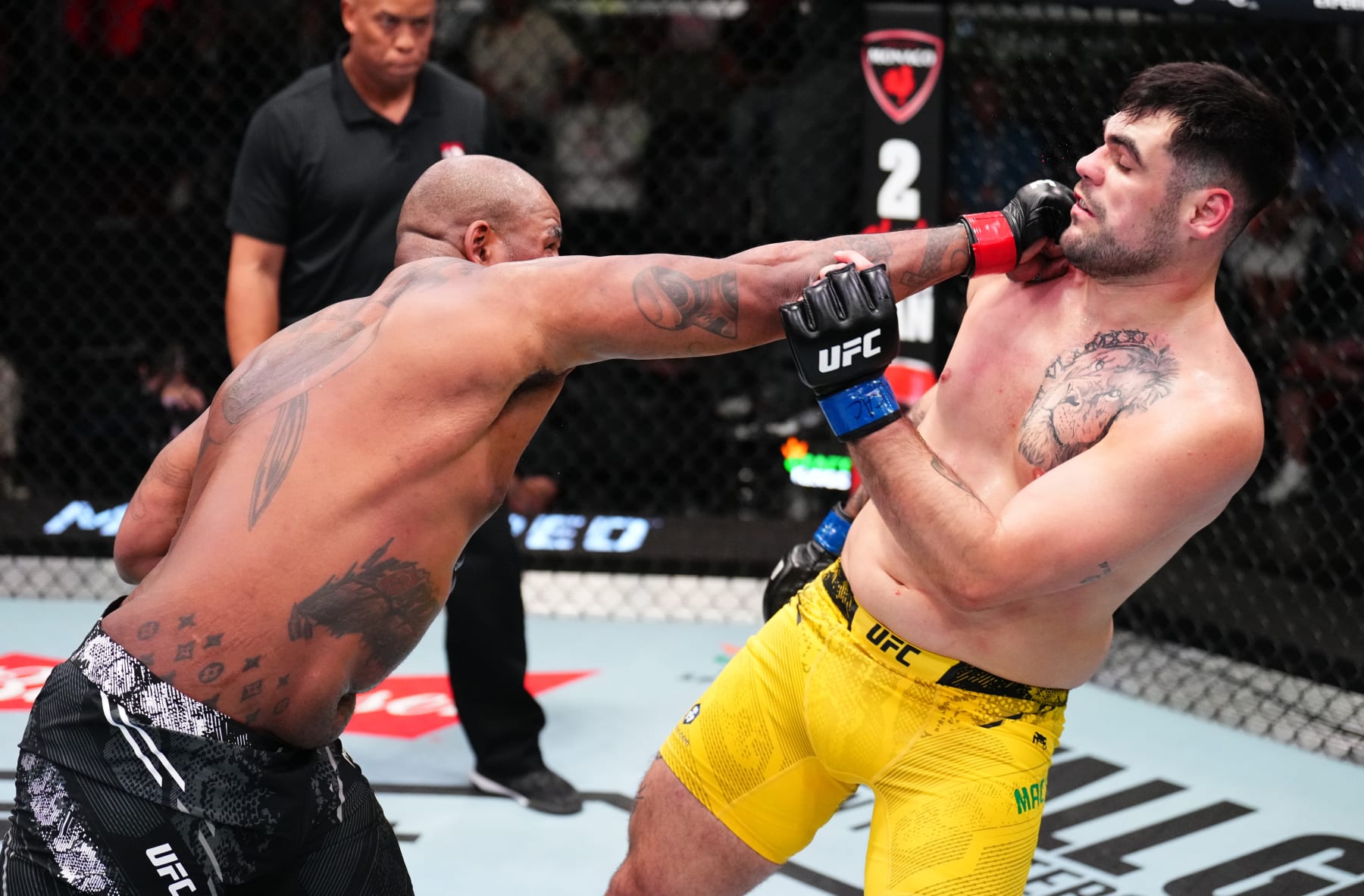LAS VEGAS, NEVADA - APRIL 27: (L-R) Don'Tale Mayes punches Caio Machado of Brazil in a heavyweight bout during the UFC Fight Night event at UFC APEX on April 27, 2024 in Las Vegas, Nevada. (Photo by Chris Unger/Zuffa LLC via Getty Images)
