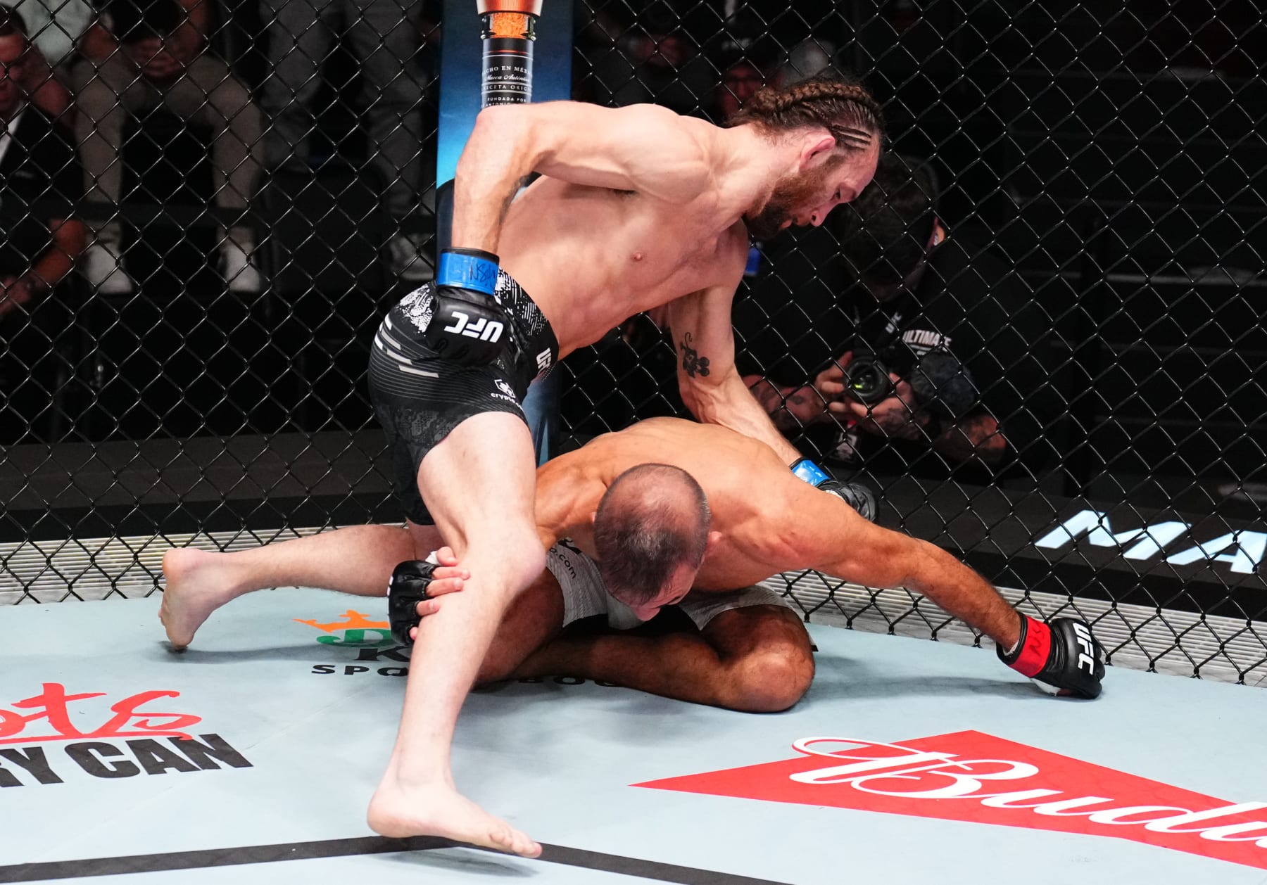 LAS VEGAS, NEVADA - APRIL 27: (L-R) Victor Henry punches Rani Yahya of Brazil in a bantamweight bout during the UFC Fight Night event at UFC APEX on April 27, 2024 in Las Vegas, Nevada. (Photo by Chris Unger/Zuffa LLC via Getty Images)