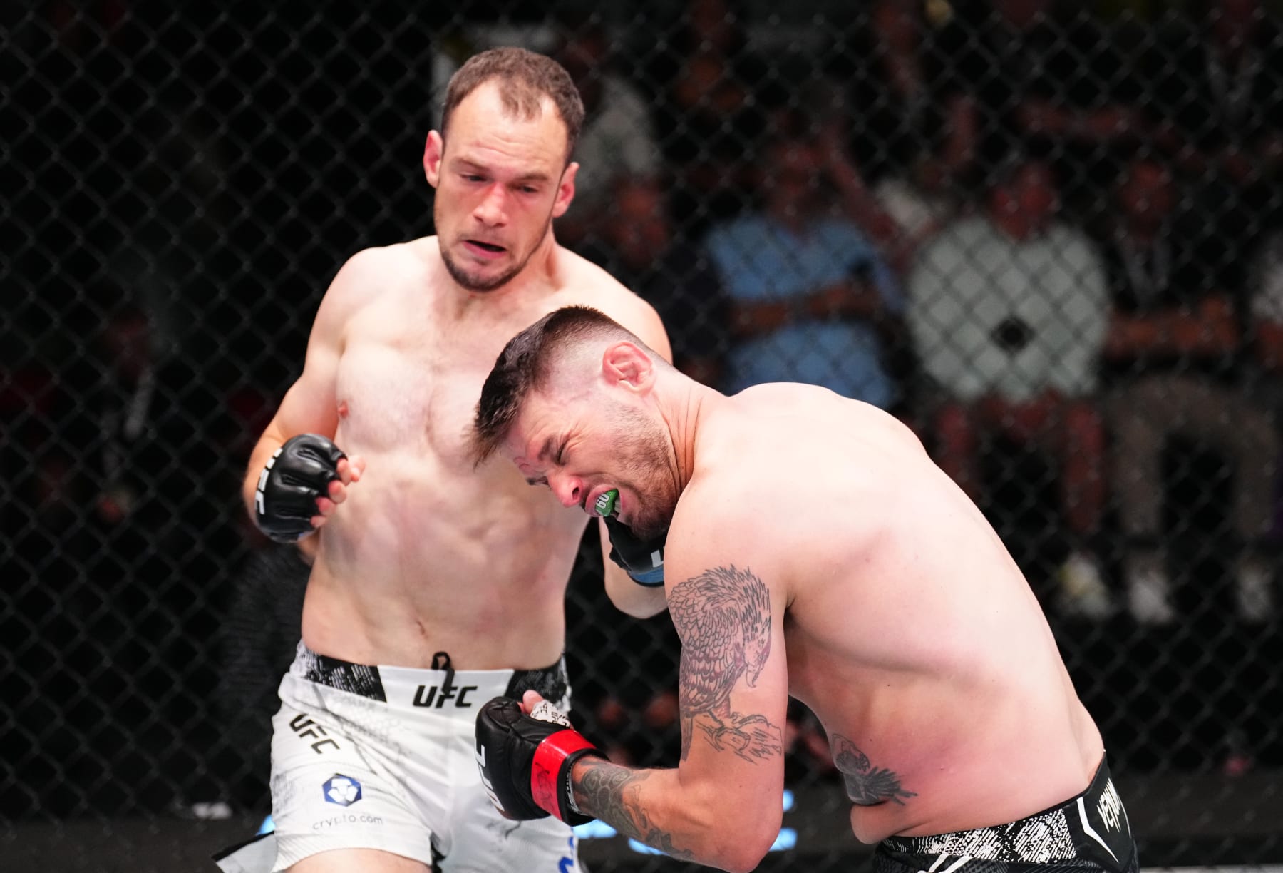 LAS VEGAS, NEVADA - APRIL 27: (L-R) Uros Medic of Serbia drops Tim Means with a punch in a welterweight bout during the UFC Fight Night event at UFC APEX on April 27, 2024 in Las Vegas, Nevada. (Photo by Chris Unger/Zuffa LLC via Getty Images)