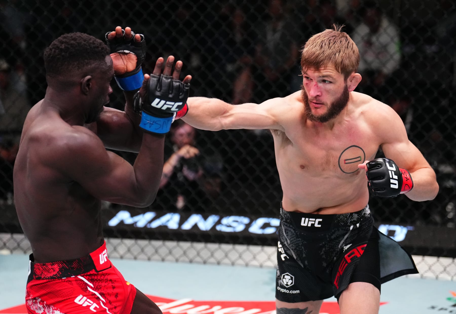 LAS VEGAS, NEVADA - APRIL 27: (R-L) Jonathan Pearce punches David Onama of Uganda in a featherweight bout during the UFC Fight Night event at UFC APEX on April 27, 2024 in Las Vegas, Nevada. (Photo by Chris Unger/Zuffa LLC via Getty Images)