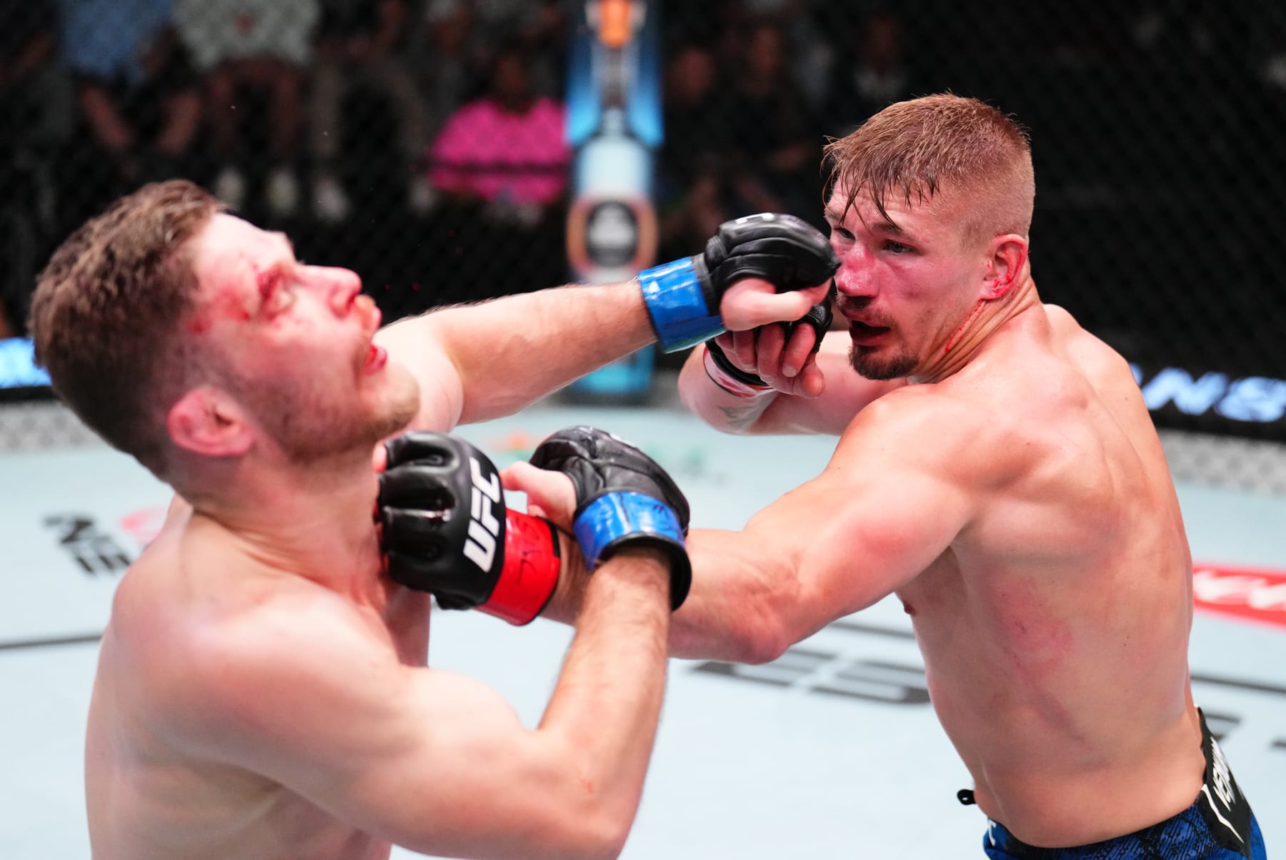LAS VEGAS, NEVADA - APRIL 27: (R-L) Austin Hubbard punches Michal Figlak of Poland in a lightweight bout during the UFC Fight Night event at UFC APEX on April 27, 2024 in Las Vegas, Nevada. (Photo by Chris Unger/Zuffa LLC via Getty Images)