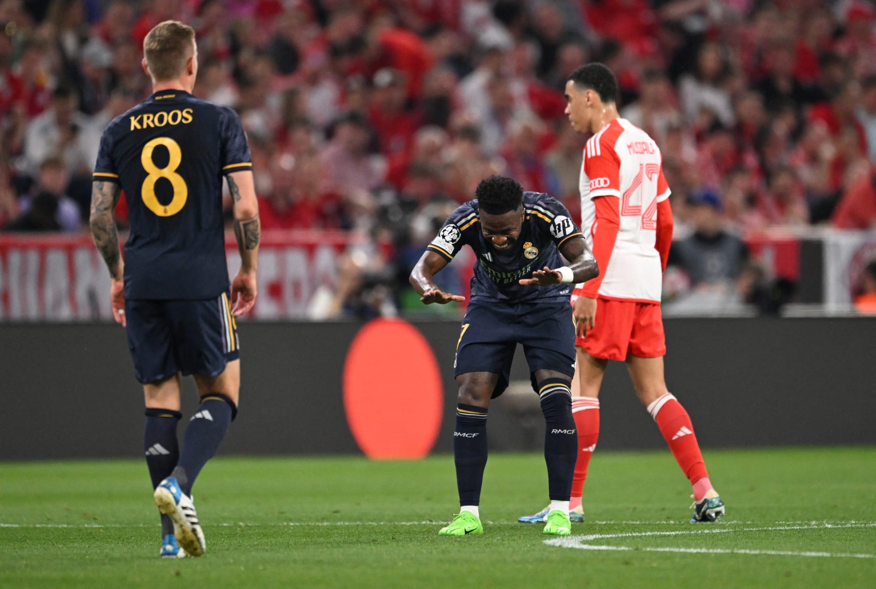 Real Madrid's Brazilian forward #07 Vinicius Junior celebrates with Real Madrid's German midfielder #08 Toni Kroos scoring during the UEFA Champions League semi-final first leg football match between FC Bayern Munich and Real Madrid CF on April 30, 2024 in Munich, southern Germany. (Photo by Kirill KUDRYAVTSEV / AFP) (Photo by KIRILL KUDRYAVTSEV/AFP via Getty Images)