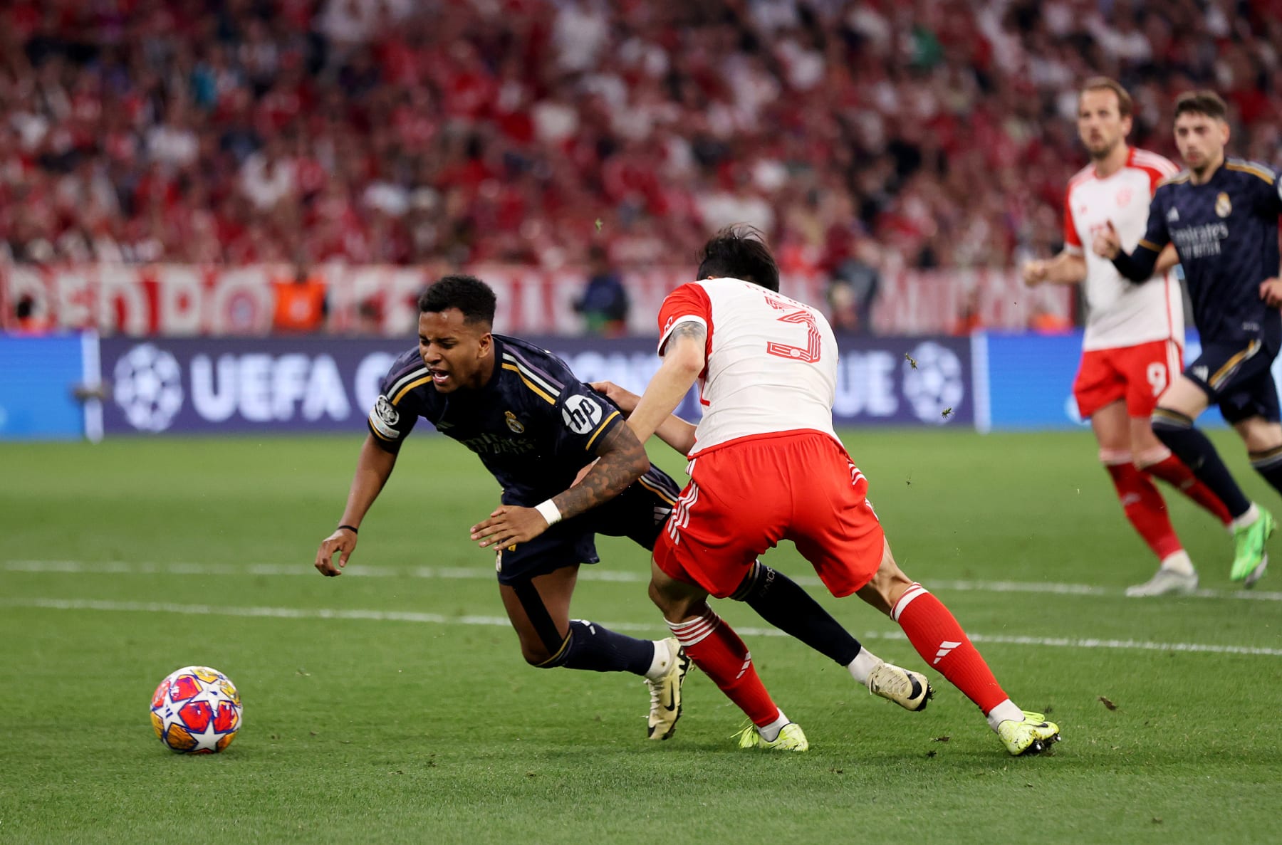 MUNICH, GERMANY - APRIL 30: Rodrygo of Real Madrid is fouled by Kim Min-Jae of Bayern Munich which results in a penalty during the UEFA Champions League semi-final first leg match between FC Bayern München and Real Madrid at Allianz Arena on April 30, 2024 in Munich, Germany. (Photo by Alex Pantling/Getty Images)