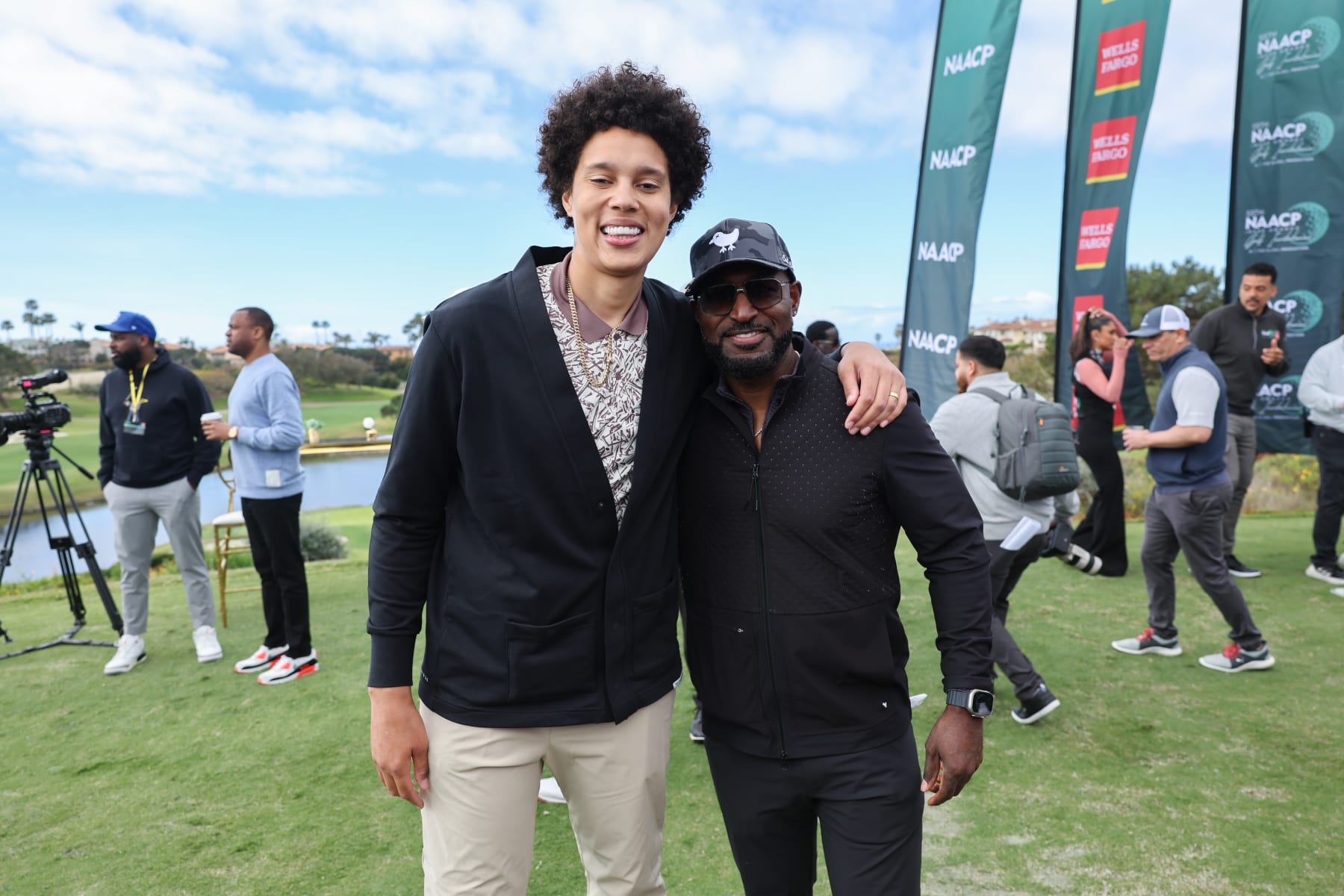 DANA POINT, CALIFORNIA - MARCH 12: WNBA champion Brittney Griner (L) and actor - NAACP nominee Adrian Holmes attend the 55th NAACP Image Awards Golf Invitational presented by Wells Fargo, a PGD Global Production at Monarch Beach Club on March 12, 2024 in Dana Point, California. (Photo by Randy Shropshire/Getty Images for PGD Global, Inc)