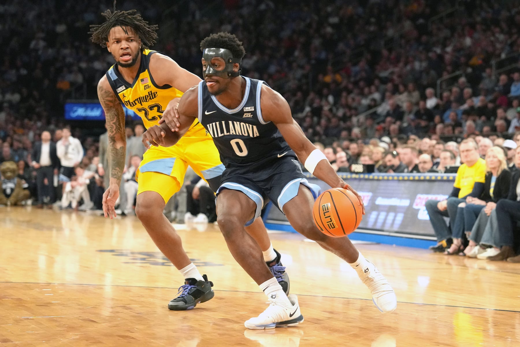 NEW YORK, NY - MARCH 14: TJ Bamba #0 of the Villanova Wildcats dribbles the ball by David Joplin #23 of the Marquette Golden Eagles during the Quarterfinals of the Big East Basketball Tournament at Madison Square Garden on March 14, 2024 in New York City. (Photo by Mitchell Layton/Getty Images)