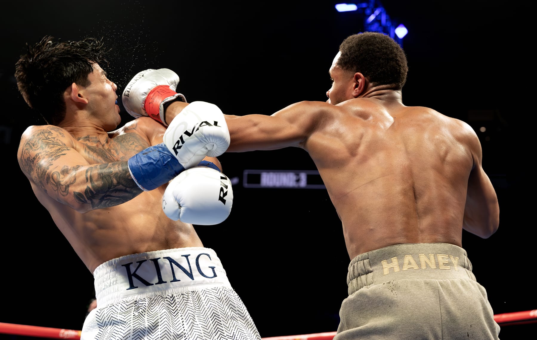 NEW YORK, NEW YORK - APRIL 20: Devin Haney (gray trunks) punches Ryan Garcia (white trunks) during their WBC Super Lightweight title bout at Barclays Center on April 20, 2024 in New York City. (Photo by Al Bello/Getty Images)