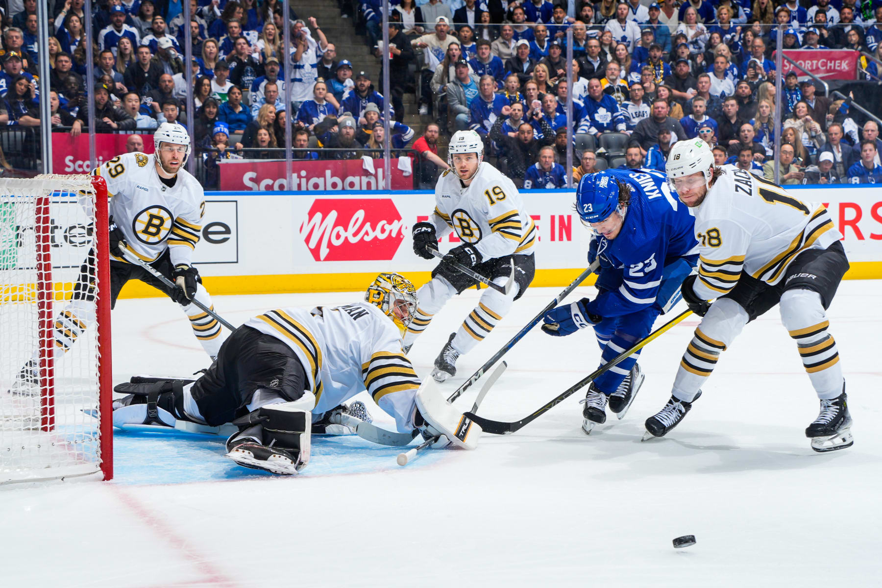 TORONTO, ON - MAY 2: Matthew Knies #23 of the Toronto Maple Leafs skates to the net against Pavel Zacha #18 and Jeremy Swayman #1 of the Boston Bruins during the first period in Game Six of the First Round of the 2024 Stanley Cup Playoffs at Scotiabank Arena on May 2, 2024 in Toronto, Ontario, Canada. (Photo by Mark Blinch/NHLI via Getty Images)
