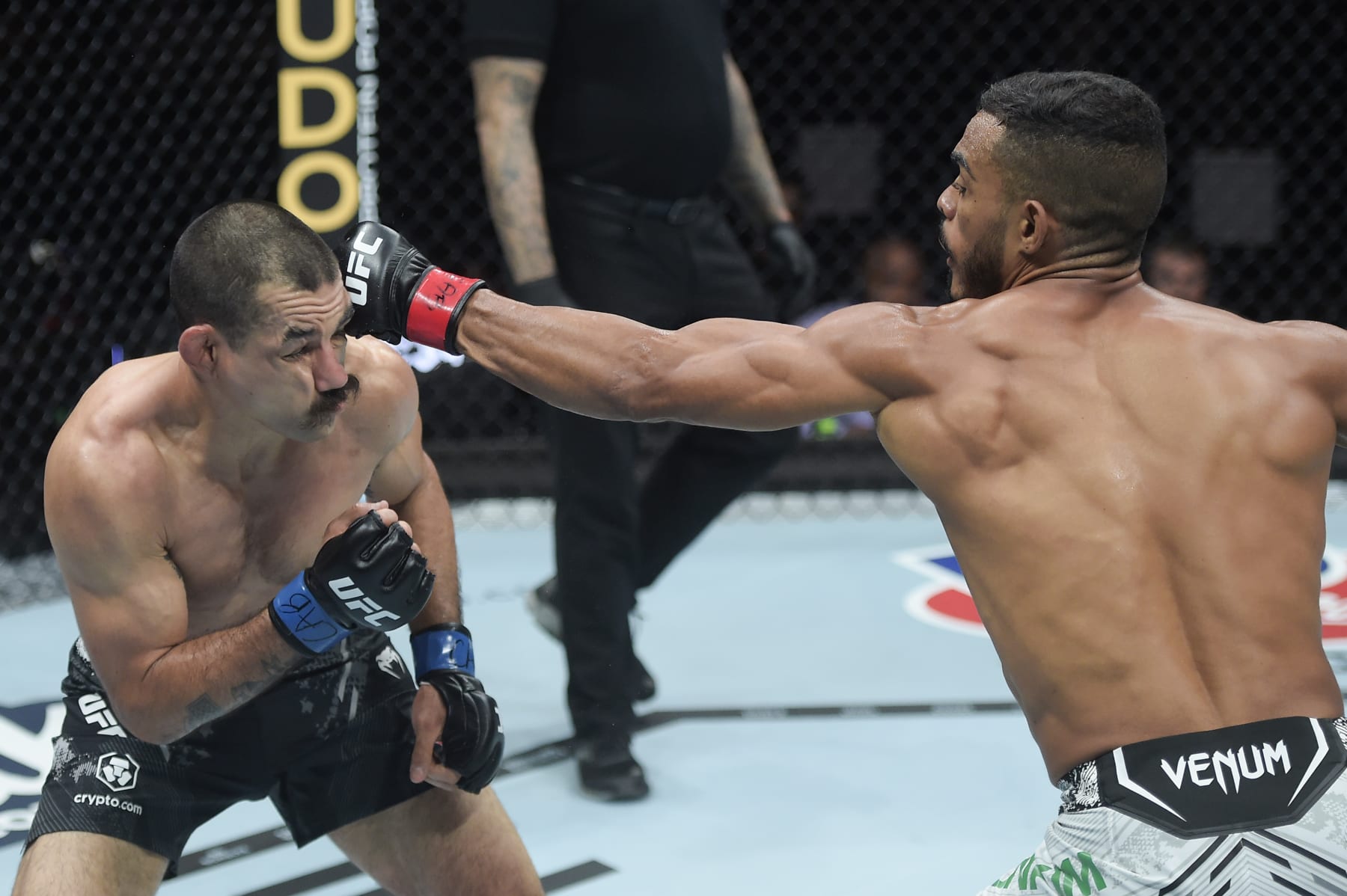 RIO DE JANEIRO, BRAZIL - MAY 04: (R-L) Ismael Bonfim of Brazil punches Vinc Pichel in a lightweight bout during the UFC 301 event at Farmasi Arena on May 04, 2024 in Rio de Janeiro, Brazil. (Photo by Alexandre Loureiro/Zuffa LLC via Getty Images)