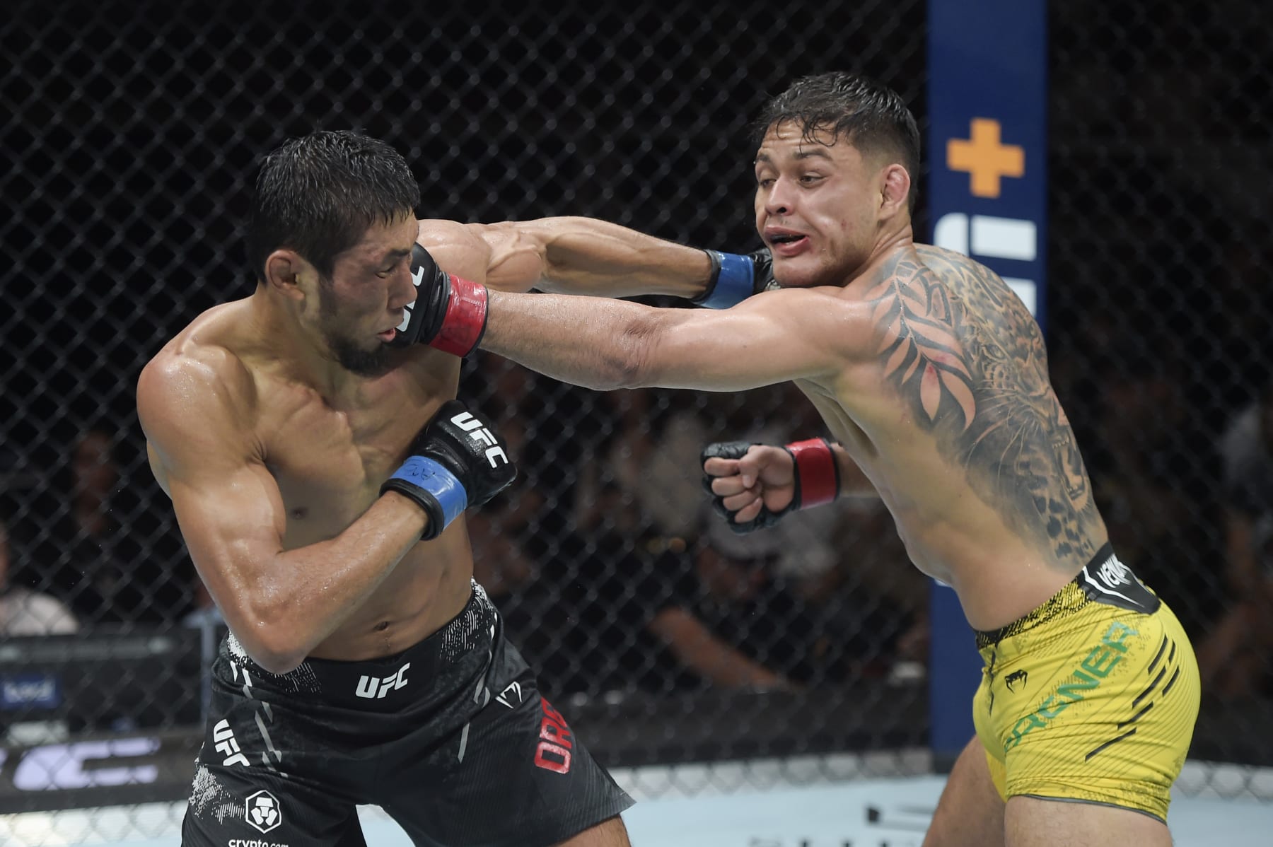 RIO DE JANEIRO, BRAZIL - MAY 04: (L-R) Myktybek Orolbai of Kyrgyzstan and Elves Brener of Brazil trade punches in a lightweight bout during the UFC 301 event at Farmasi Arena on May 04, 2024 in Rio de Janeiro, Brazil. (Photo by Alexandre Loureiro/Zuffa LLC via Getty Images)