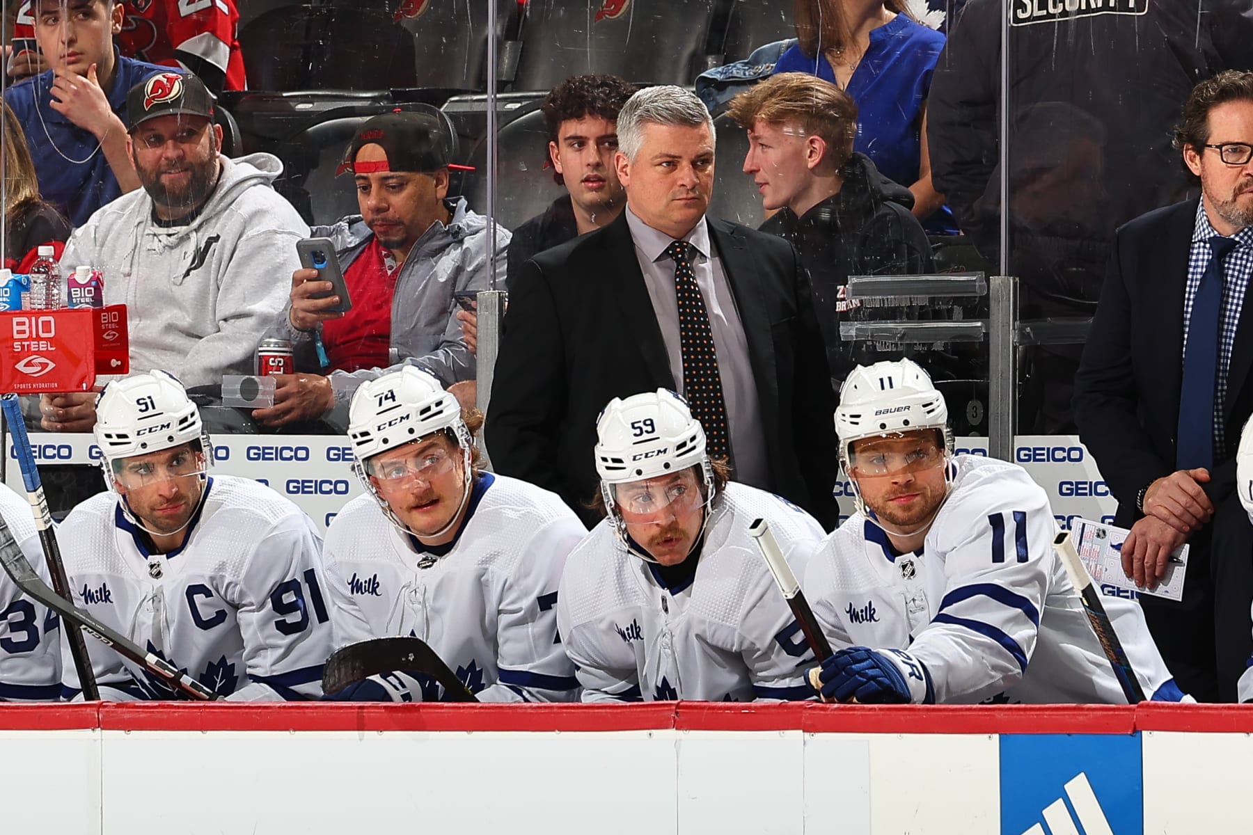 NEWARK, NJ - APRIL 09: Sheldon Keefe head coach of the Toronto Maple Leafs behind the bench during the game against the New Jersey Devils at the Prudential Center on April 9, 2024 in Newark, New Jersey. (Photo by Rich Graessle/NHLI via Getty Images)