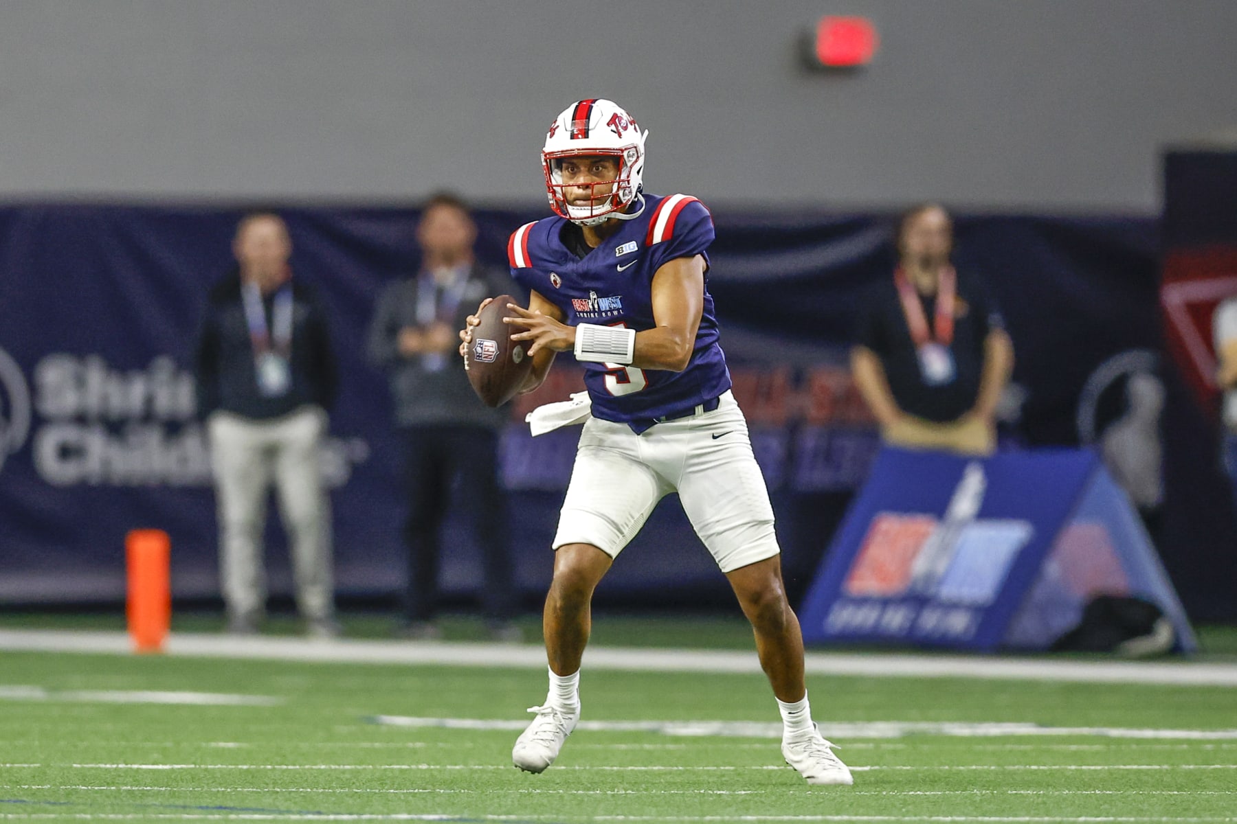 FRISCO, TX - FEBRUARY 01: West Team quarterback Taulia Tagovailoa (5) looks downfield for an open receiver during the East-West Shrine Bowl on February 1, 2024 at the Ford Center at The Star in Frisco, Texas. (Photo by Matthew Pearce/Icon Sportswire via Getty Images)
