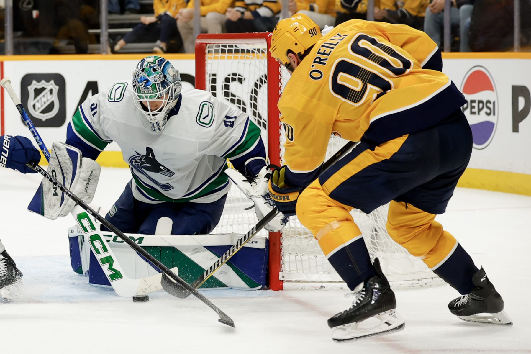 NASHVILLE, TENNESSEE - MAY 03: Arturs Silovs #31 of the Vancouver Canucks makes a save against Ryan O'Reilly #90 of the Nashville Predators during the third period in Game Six of the Western Conference First Round Playoffs at Bridgestone Arena on May 03, 2024 in Nashville, Tennessee. (Photo by Brett Carlsen/Getty Images)