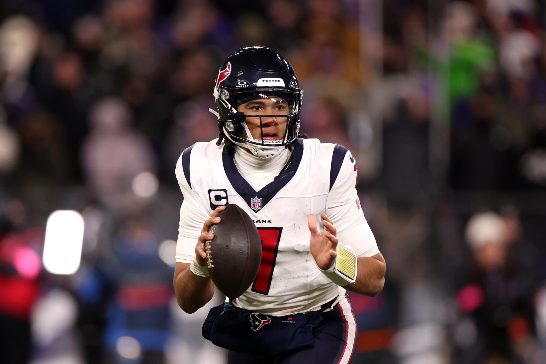 BALTIMORE, MARYLAND - JANUARY 20: Quarterback C.J. Stroud #7 of the Houston Texans looks to pass against the Baltimore Ravens during the AFC Divisional Playoff game at M&T Bank Stadium on January 20, 2024 in Baltimore, Maryland. (Photo by Rob Carr/Getty Images)