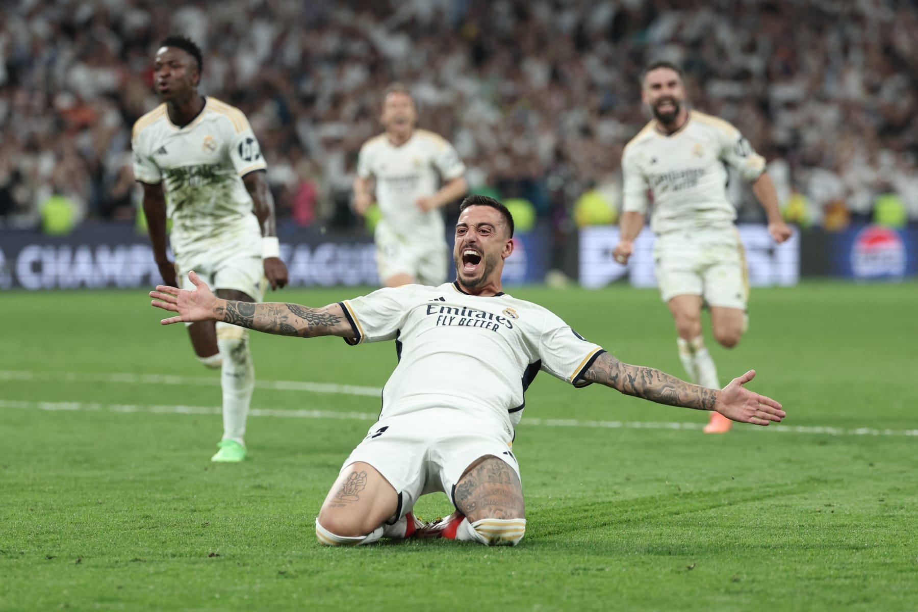 Real Madrid's Spanish forward #14 Joselu celebrates scoring during the UEFA Champions League semi final second leg football match between Real Madrid CF and FC Bayern Munich at the Santiago Bernabeu stadium in Madrid on May 8, 2024. (Photo by Thomas COEX / AFP) (Photo by THOMAS COEX/AFP via Getty Images)