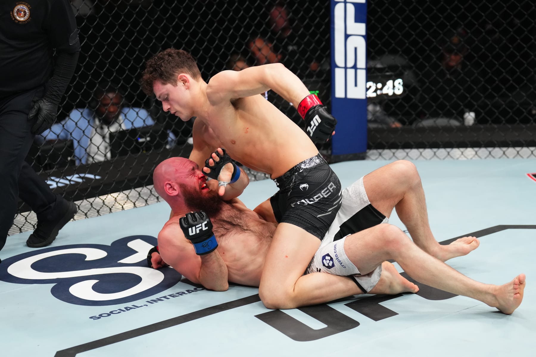 ST LOUIS, MISSOURI - MAY 11: Chase Hooper (top) punches Viacheslav Borshchev of Russia in a lightweight fight during the UFC Fight Night event at Enterprise Center on May 11, 2024 in St Louis, Missouri. (Photo by Josh Hedges/Zuffa LLC via Getty Images)