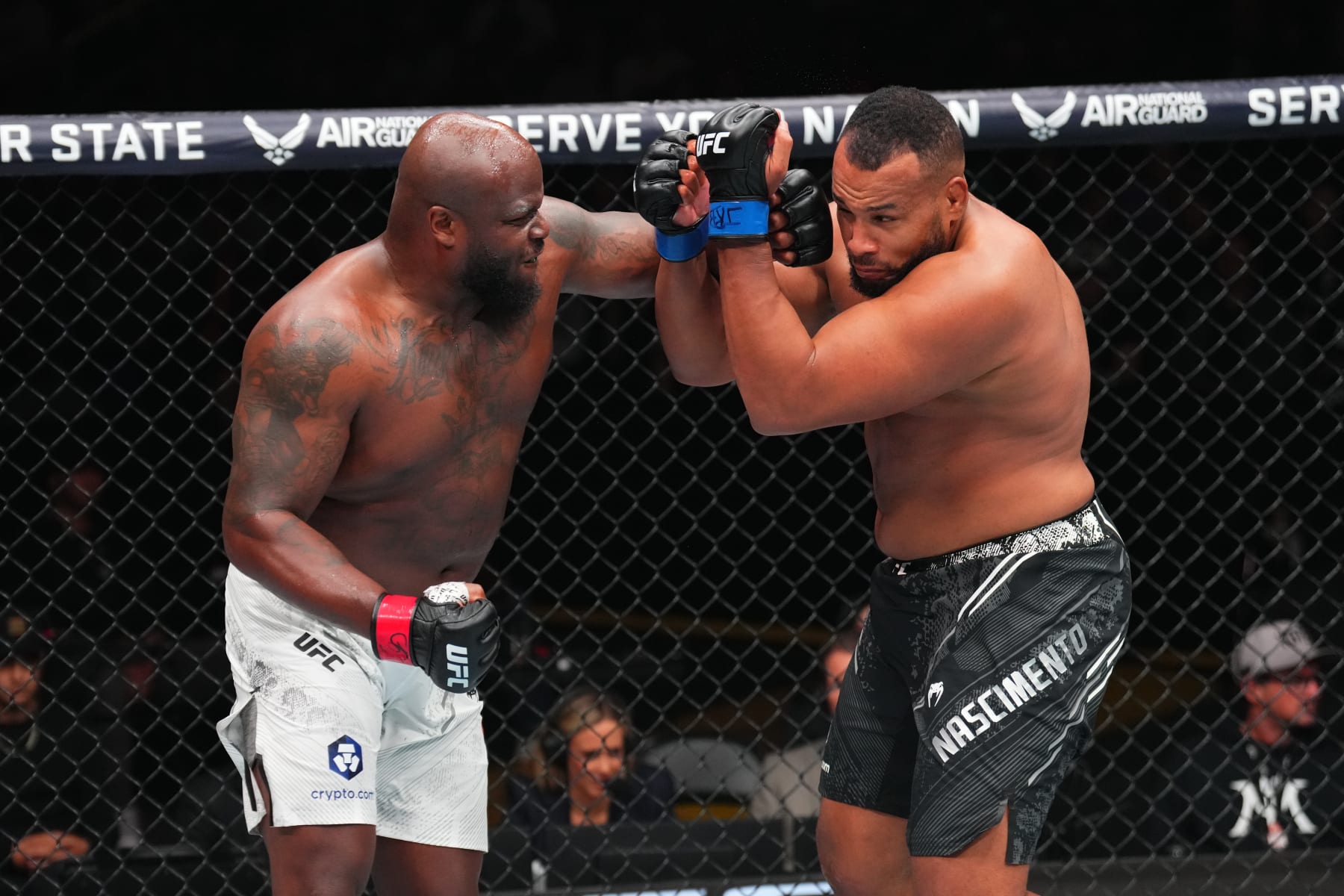 ST LOUIS, MISSOURI - MAY 11: (L-R) Derrick Lewis punches Rodrigo Nascimento of Brazil in a heavyweight fight during the UFC Fight Night event at Enterprise Center on May 11, 2024 in St Louis, Missouri. (Photo by Josh Hedges/Zuffa LLC via Getty Images)