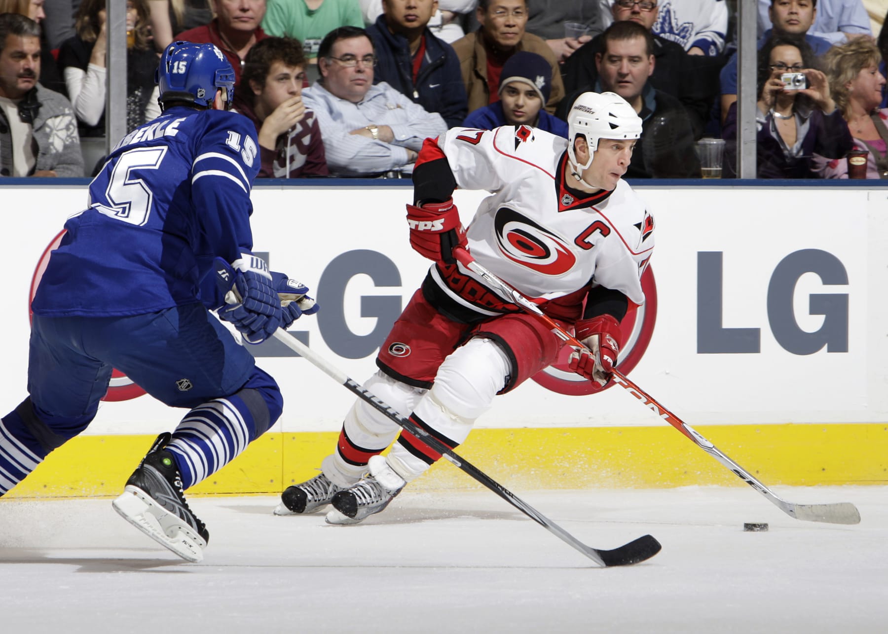 TORONTO - JANUARY 12: Tomas Kaberle #15 of the Toronto Maple Leafs defends against Rod Brind'Amour #17 of the Carolina Hurricanes during game action January 12, 2010 at the Air Canada Centre in Toronto, Ontario, Canada. (Photo by Graig Abel/NHLI via Getty Images)