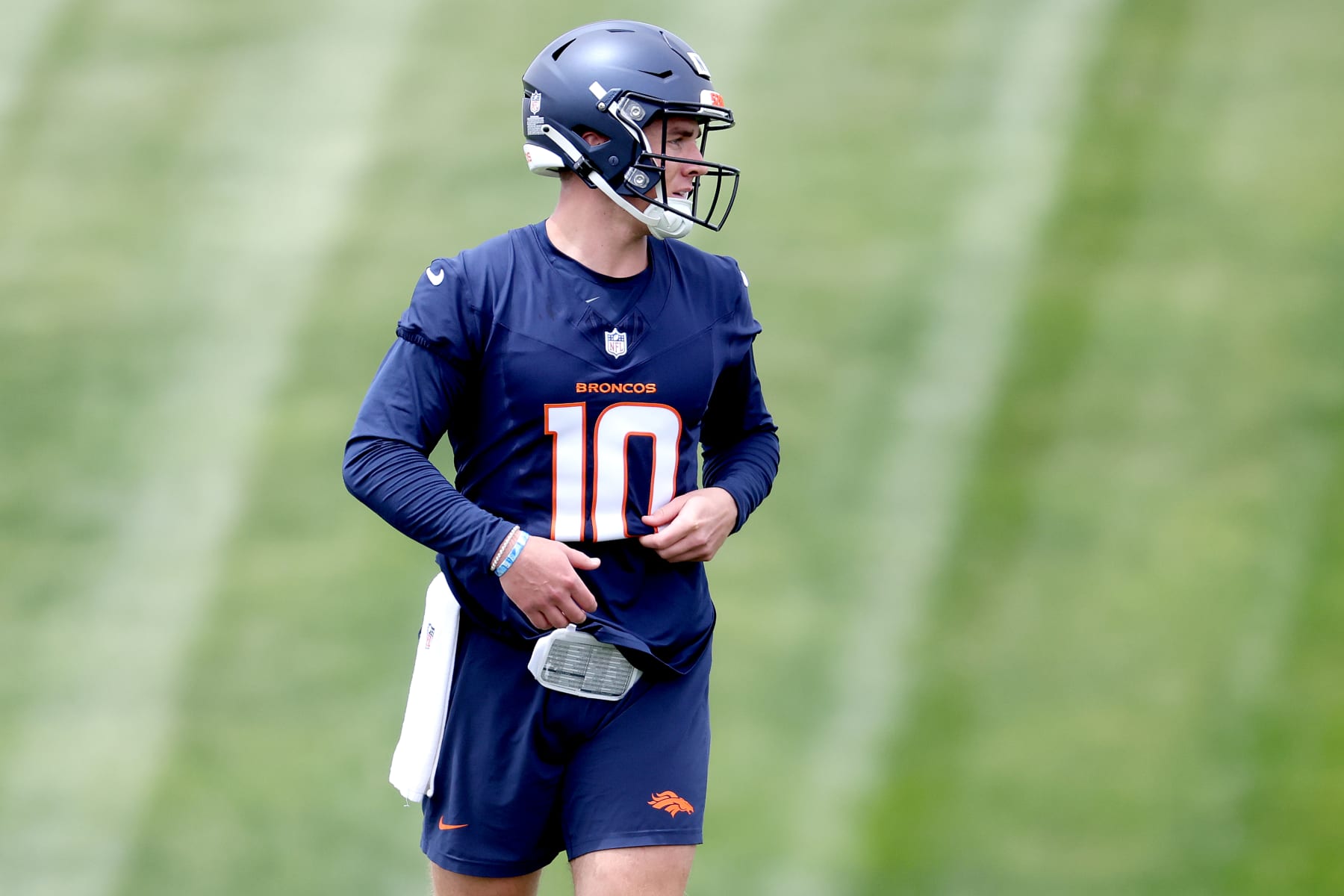 ENGLEWOOD, COLORADO - MAY 11: Quarterback Bo Nix #10 of the Denver Broncos walks on the field during Denver Broncos Rookie Minicamp at Centura Health Training Center on May 11, 2024 in Englewood, Colorado. (Photo by Matthew Stockman/Getty Images)