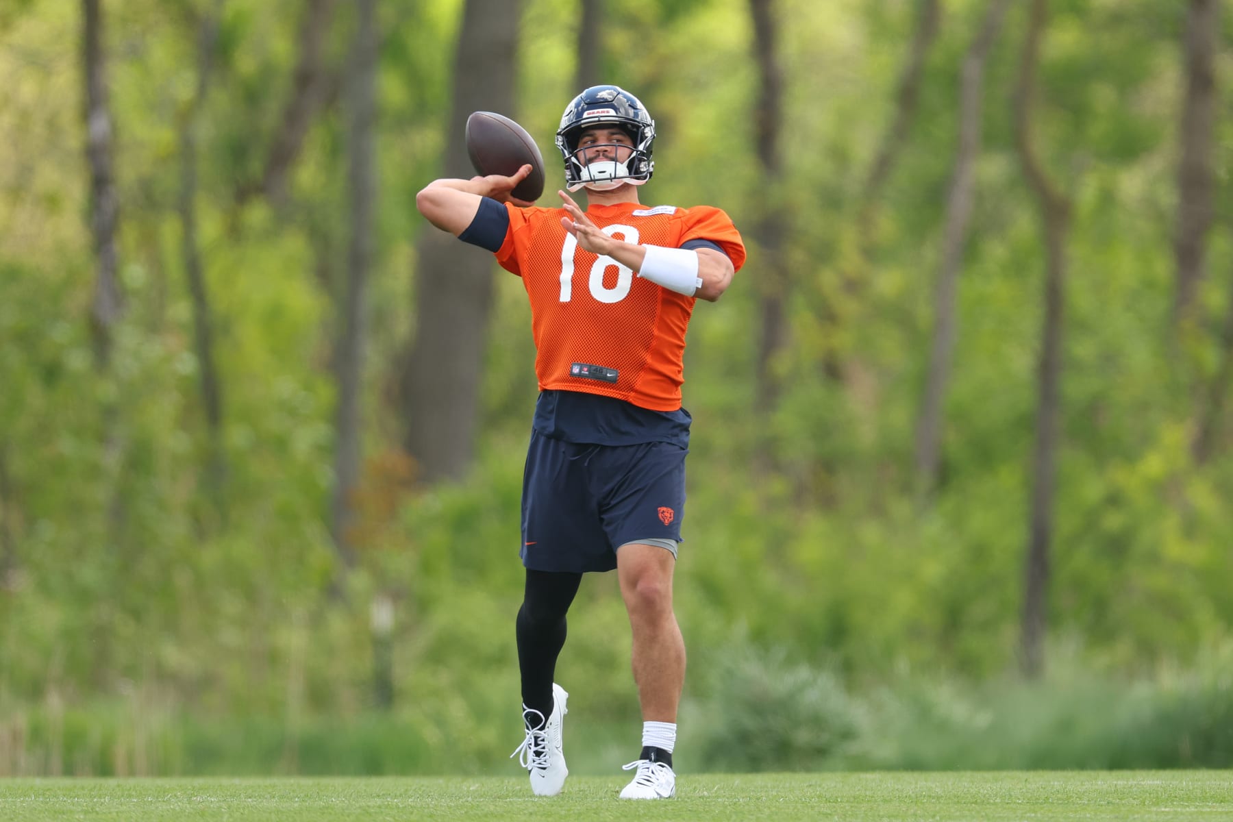 LAKE FOREST, ILLINOIS - MAY 11: Caleb Williams #18 of the Chicago Bears throws a pass during Chicago Bears Rookie Minicamp at Halas Hall on May 11, 2024 in Lake Forest, Illinois. (Photo by Michael Reaves/Getty Images)