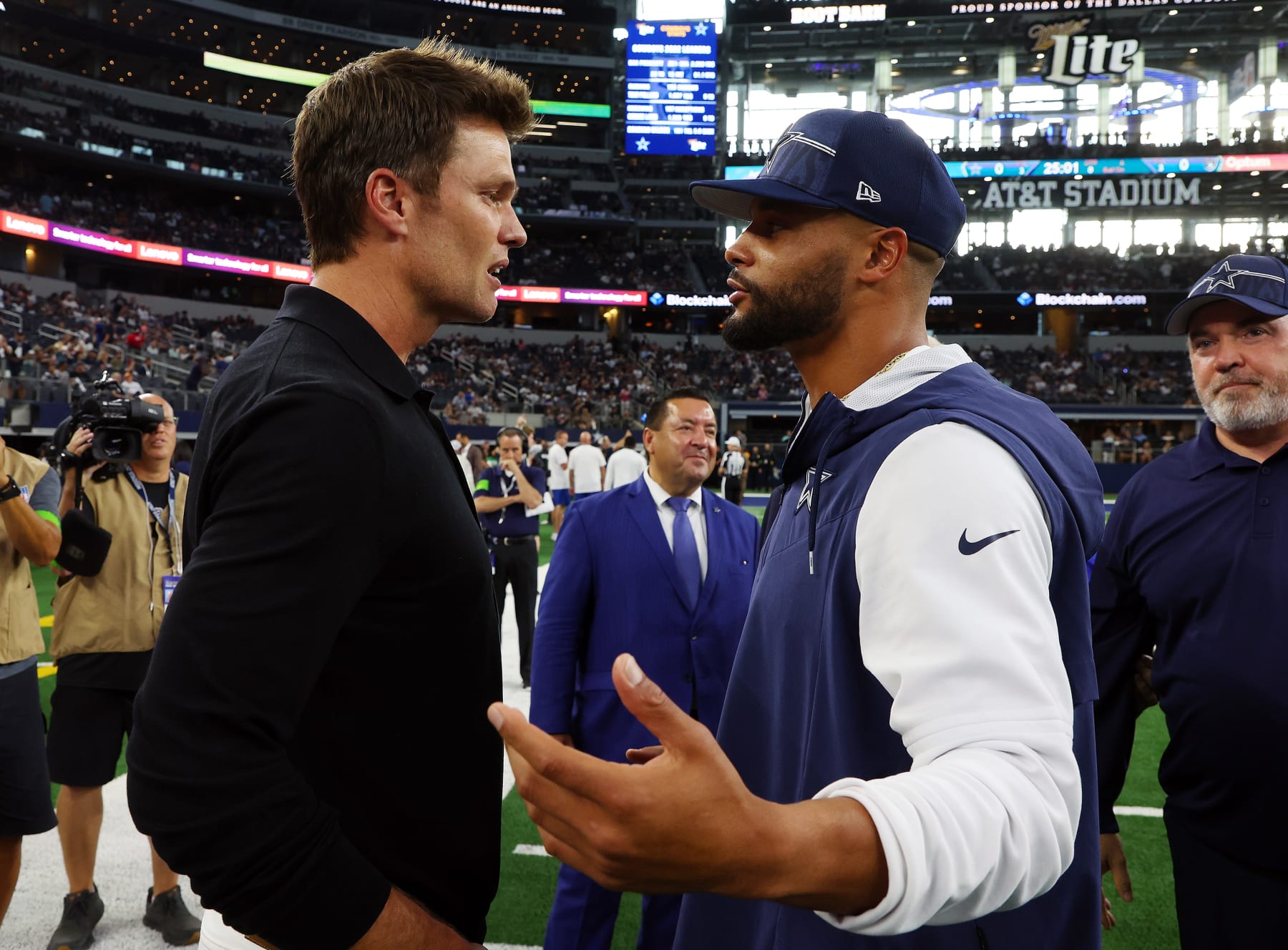 ARLINGTON, TEXAS - AUGUST 26: Tom Brady visits with Dak Prescott #4 of the Dallas Cowboys before a preseason game against the Las Vegas Raiders at AT&T Stadium on August 26, 2023 in Arlington, Texas. (Photo by Richard Rodriguez/Getty Images)